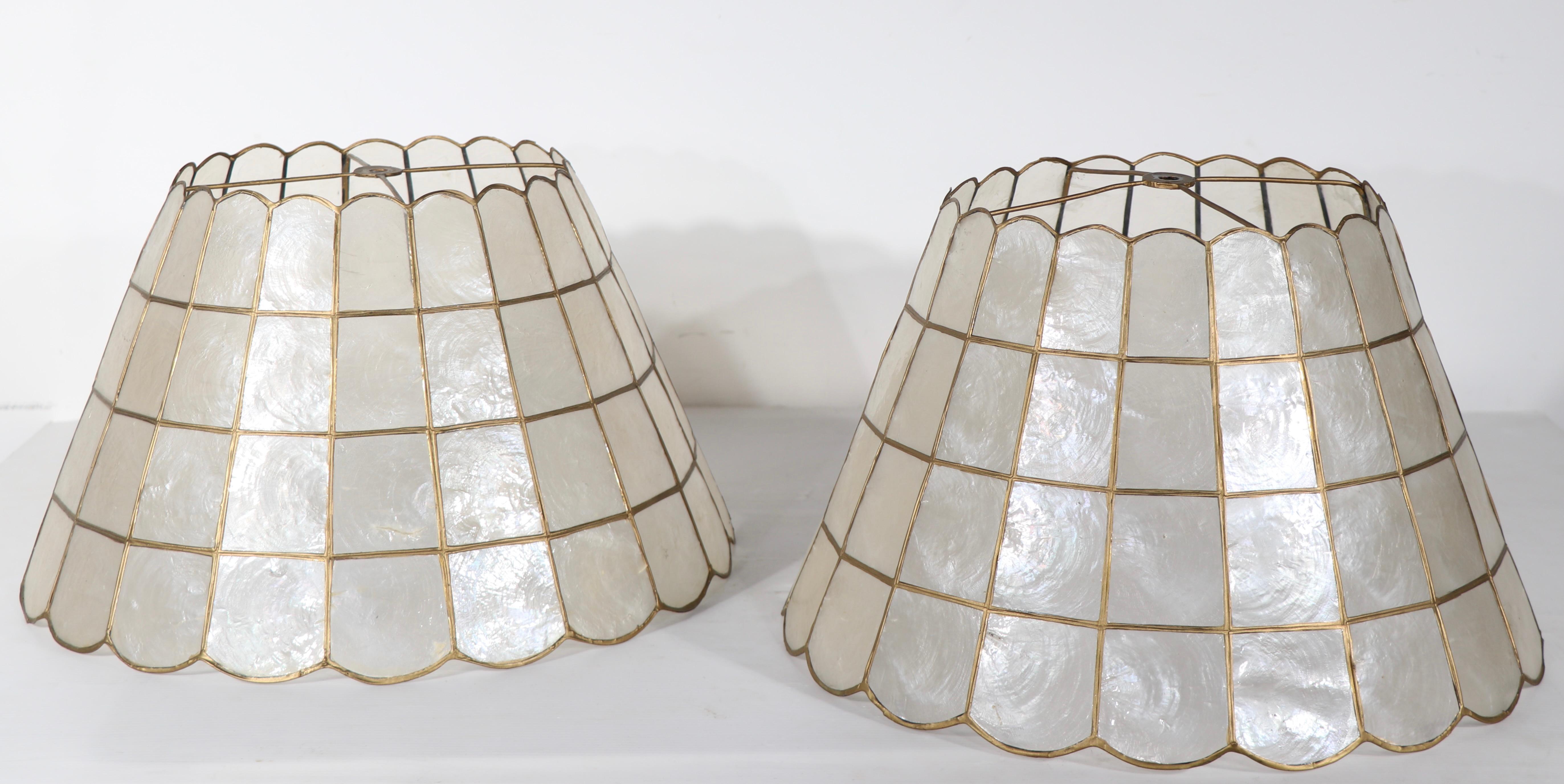 Pair of vintage Capiz Shell lamp shades, both are in good, clean, ready to use condition, showing only light wear, normal and consistent with age. Hard to find these nice shades in good condition, much harder to find them in pairs. Suitable for