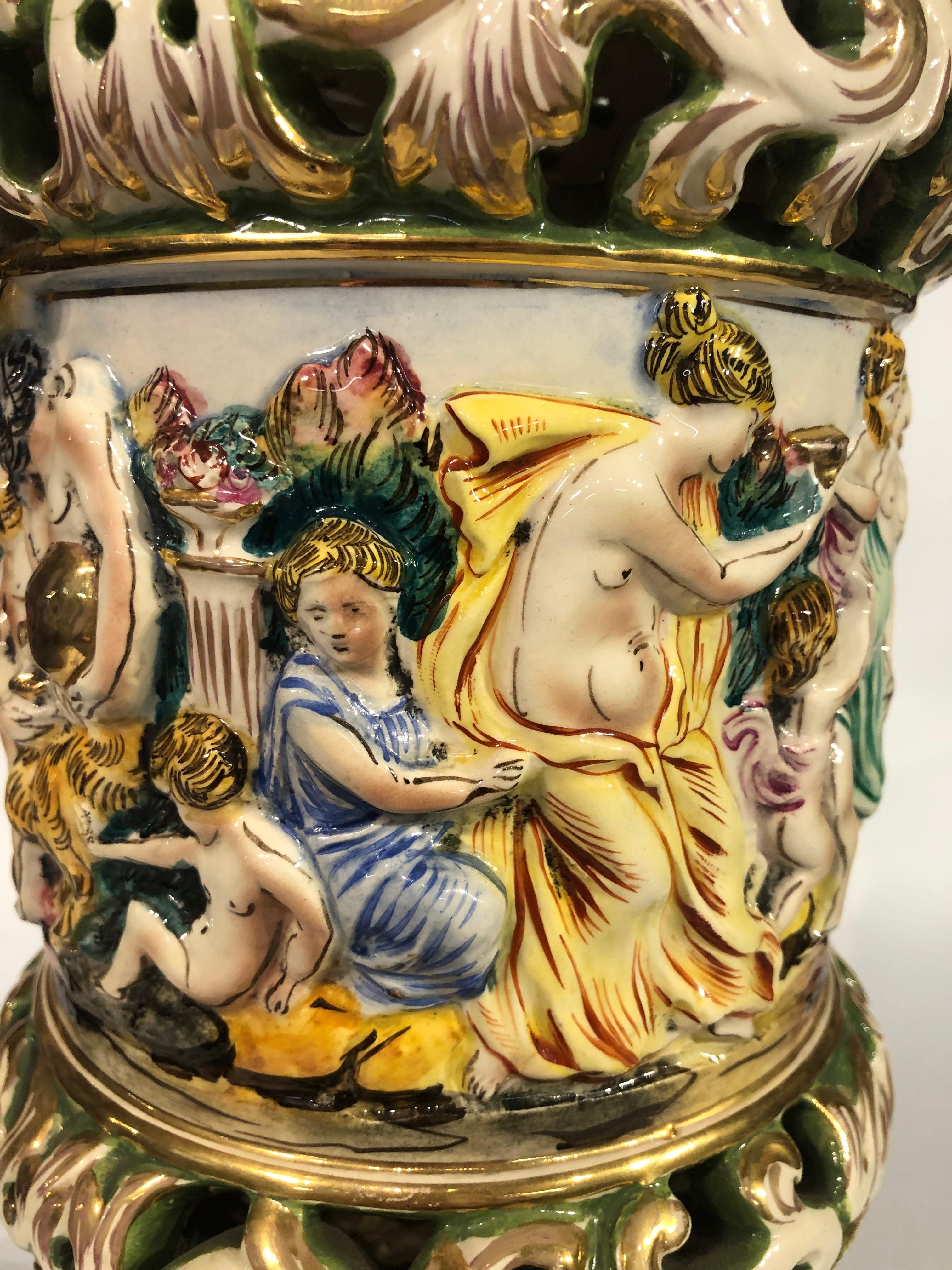 Pair of Vintage Capodimonte ceramic lamps with figurative bacchanal scene Italiano en venta