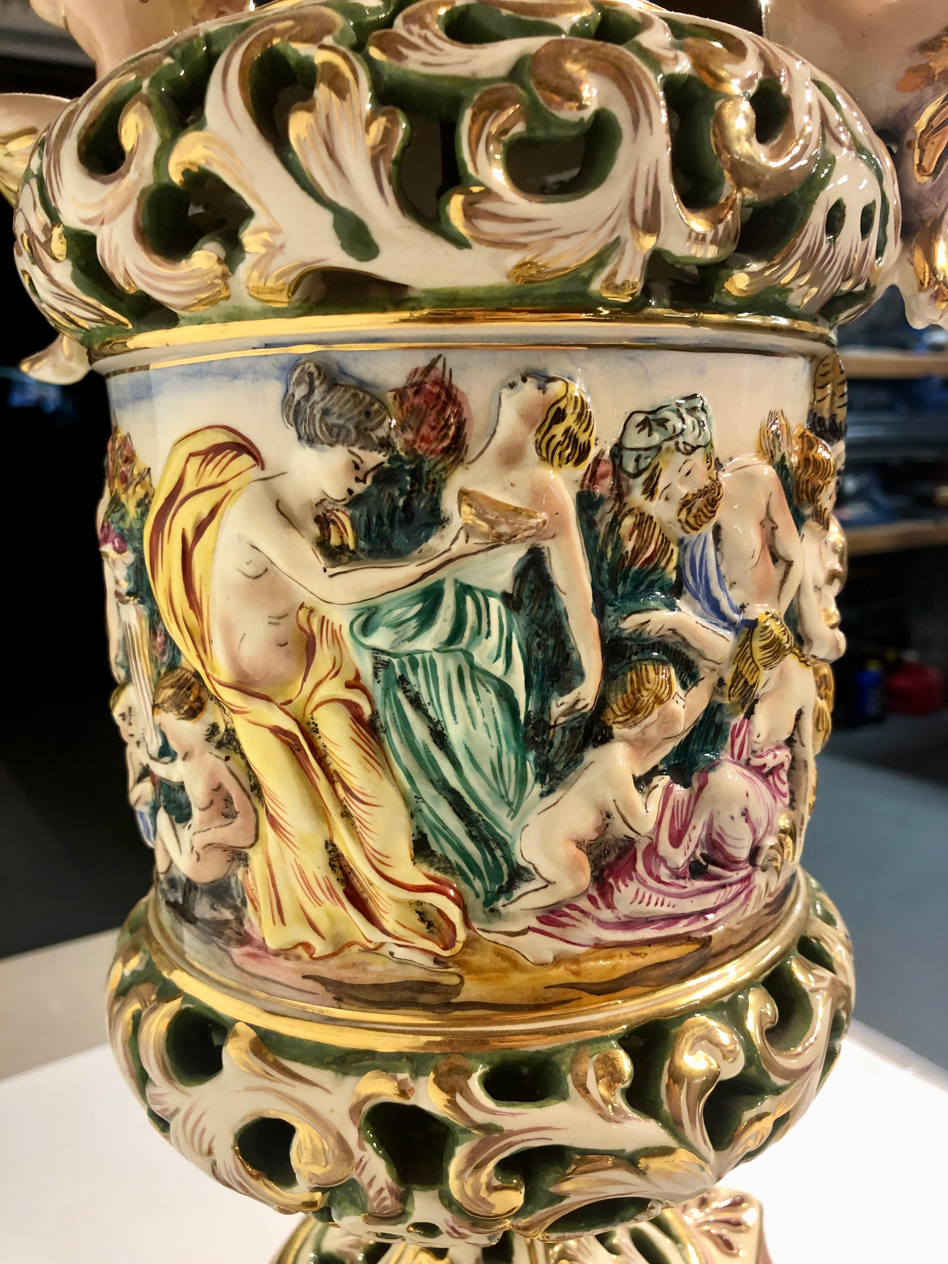 Glazed Pair of Vintage Capodimonte ceramic lamps with figurative bacchanal scene For Sale