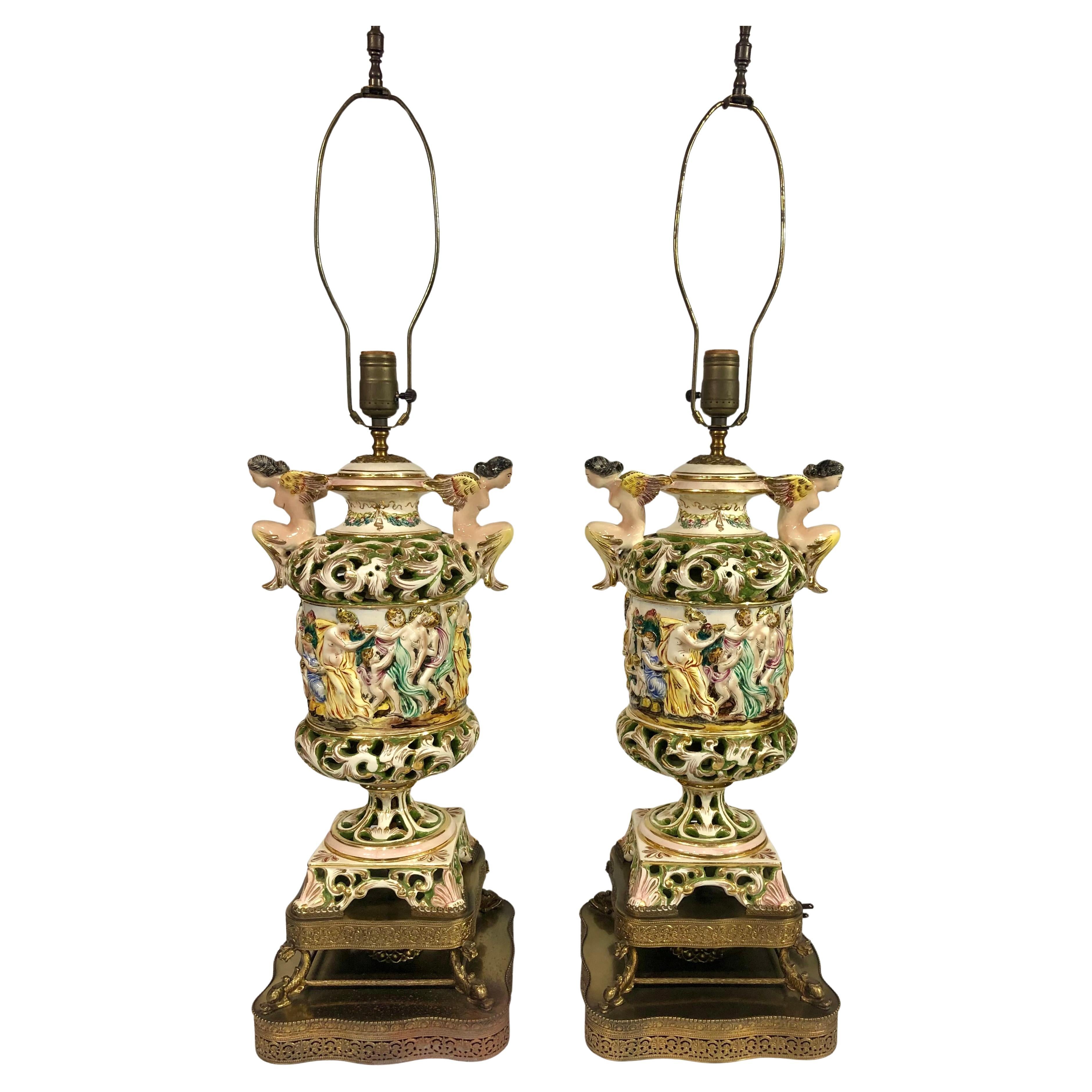 Pair of Vintage Capodimonte ceramic lamps with figurative bacchanal scene For Sale