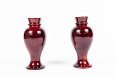 Pair of Carved Alabaster Candleholders, Dyed Red with a High Gloss Finish
