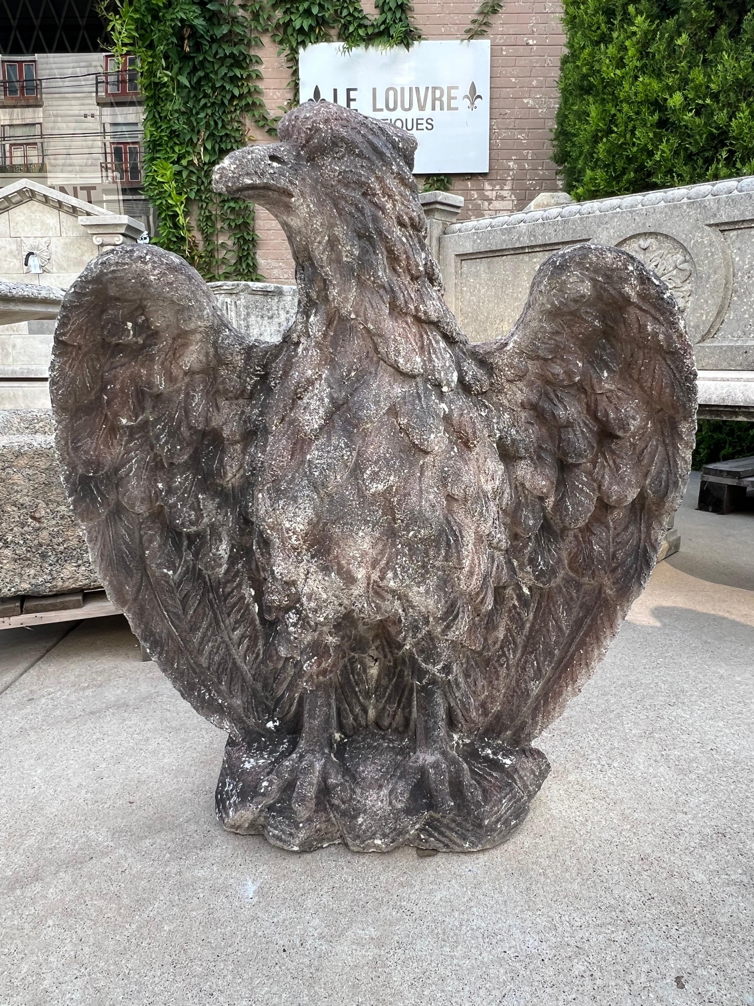20th Century Pair of Vintage Cast Stone Eagles from France For Sale