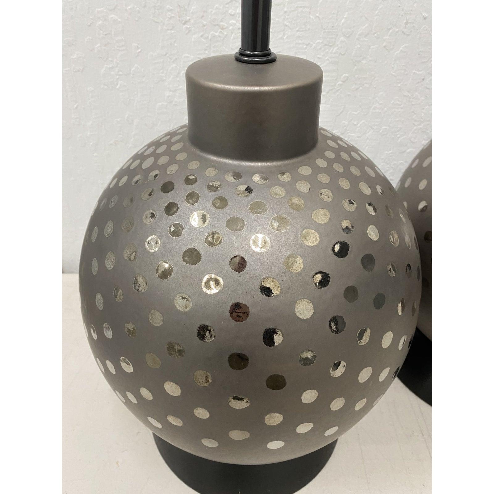 Pair of vintage ceramic metallic silver glaze ball lamps by Marbro circa 1970

Gorgeous lamps with metallic silver spots. The black shades are included in 