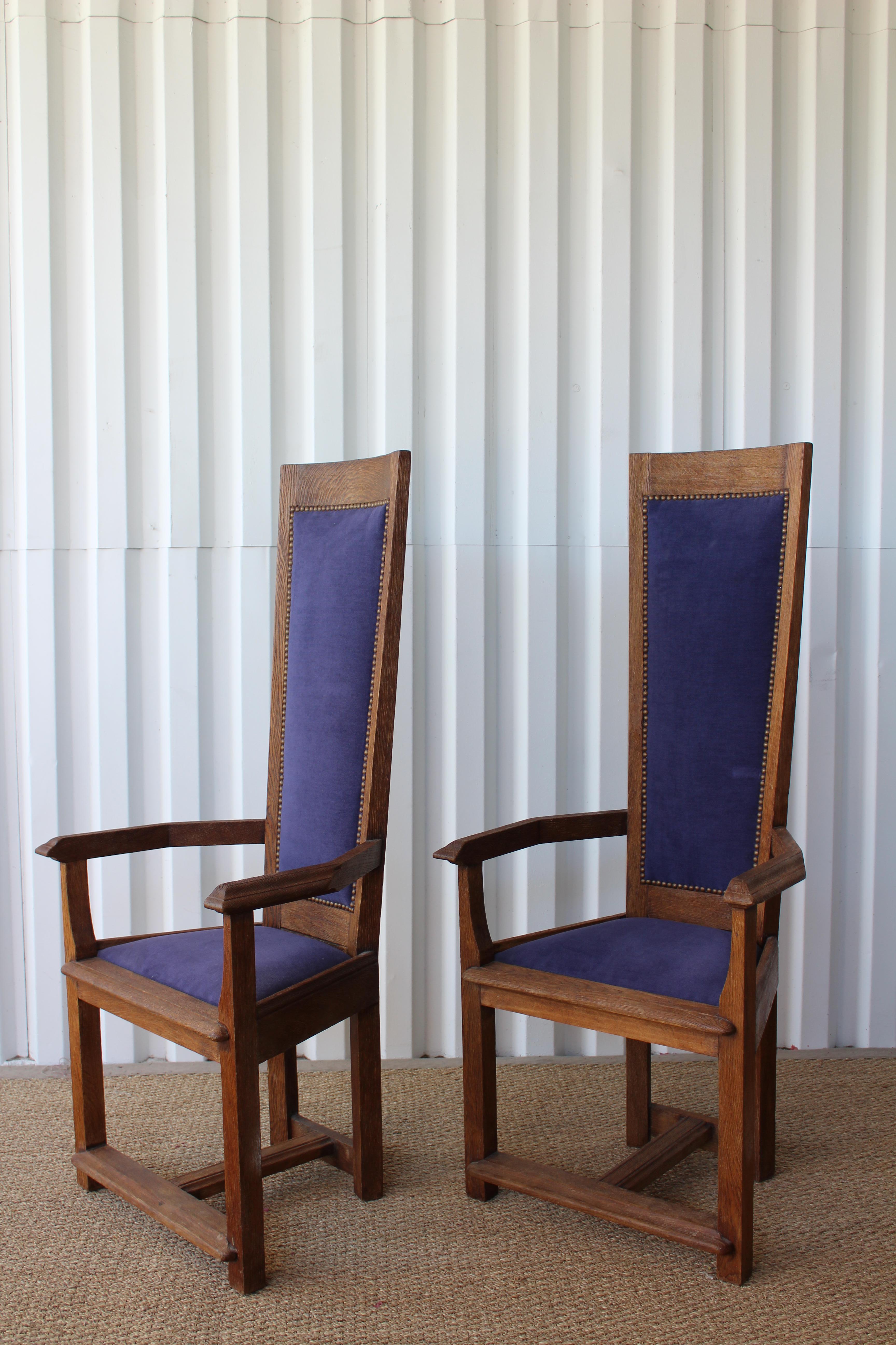 Pair of vintage hall chairs, France, 1940s. The oak frames have been sand blasted to expose the oak grain. New dark periwinkle chenille upholstery with antique brass nailhead details. Sold only as a pair.