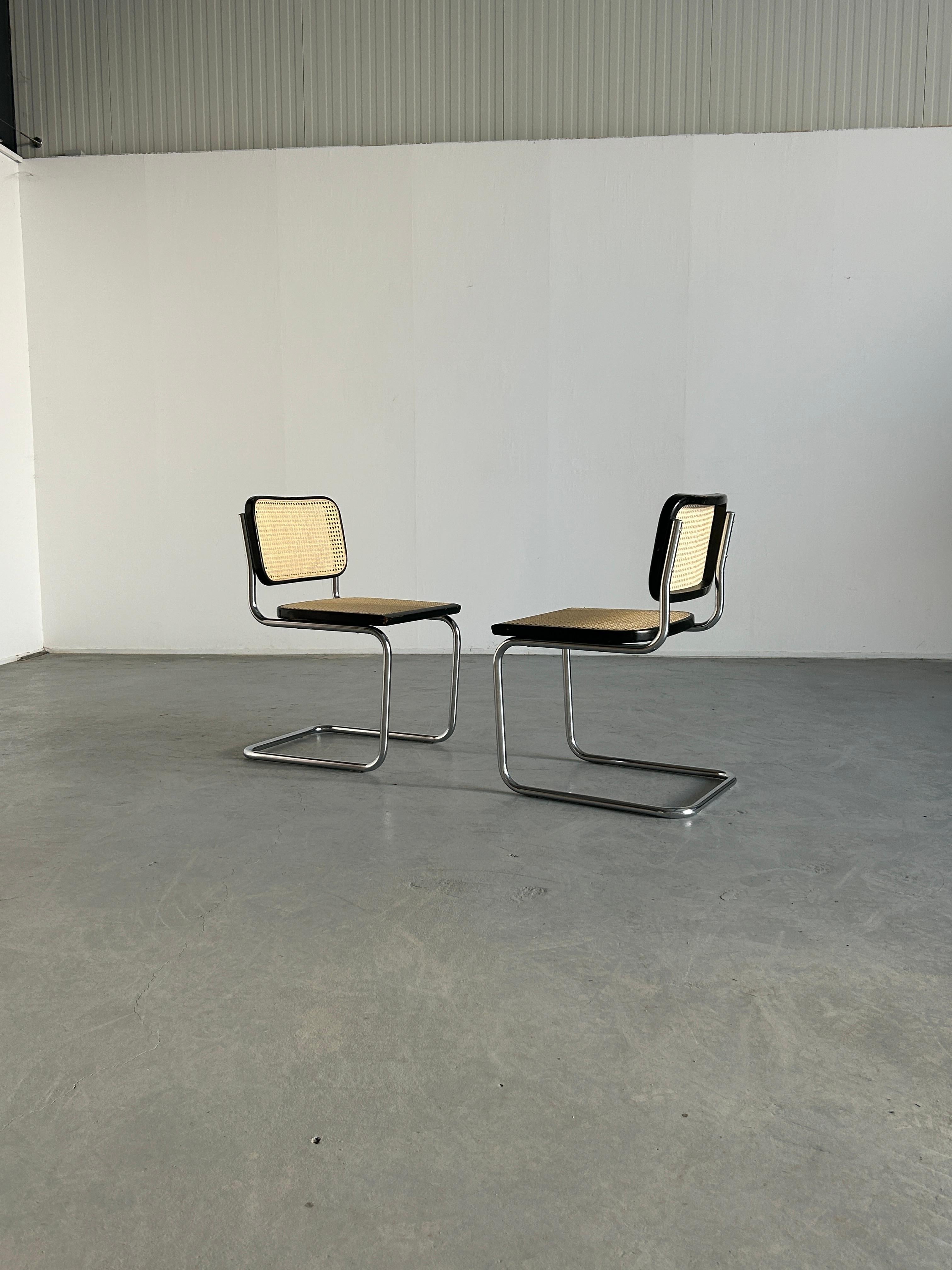 A pair of beautiful vintage Marcel Breuer design B32 cantilever chairs.
Completely original parts, and in original vintage condition.

Old cane replaced with new handmade Roddeka cane from The Netherlands.

No manufacturer's mark present, but the