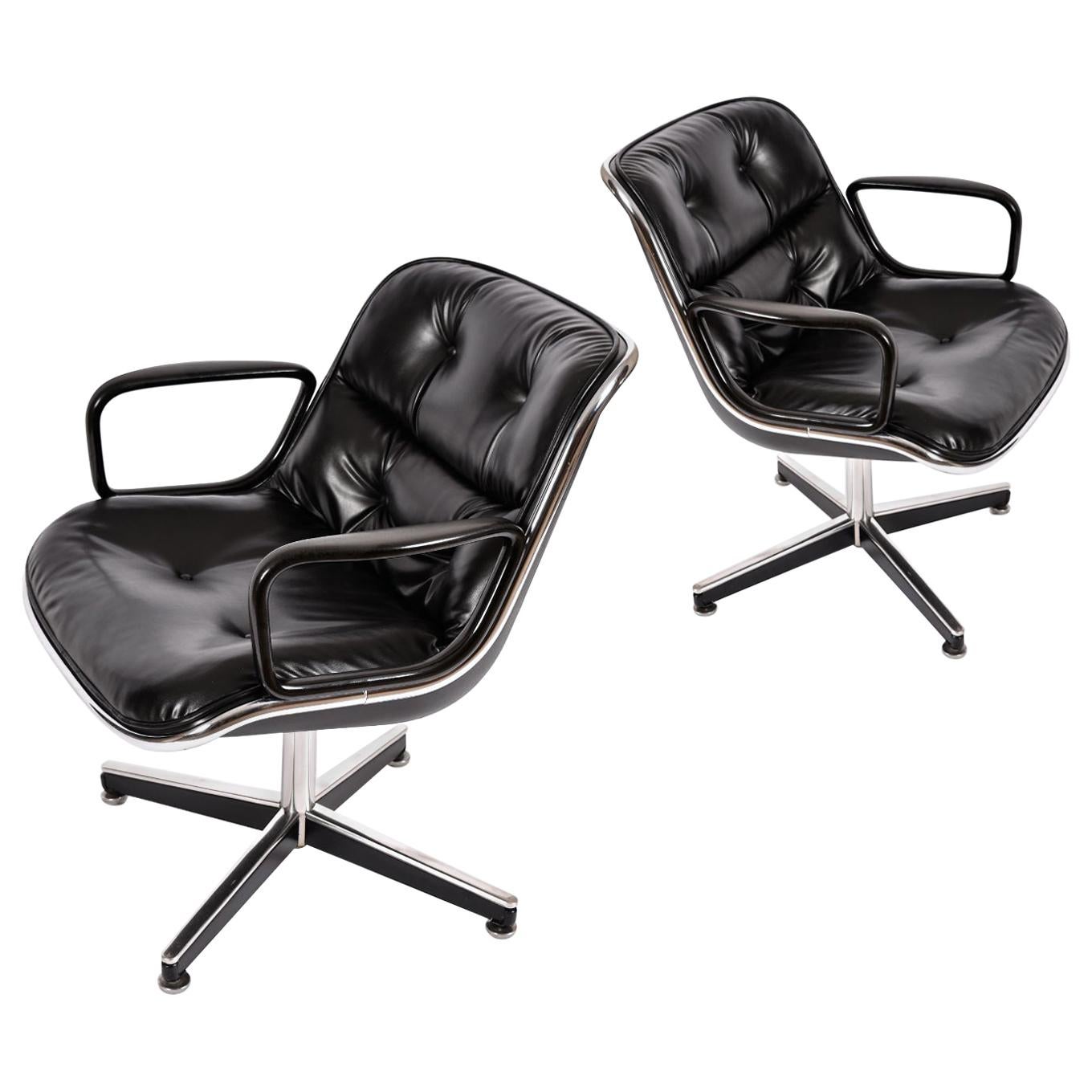 Pair of vintage 1972 executive chairs designed by Charles Pollock for Knoll. The chairs come in their original black leather upholstery. The leather is in miraculous condition for it’s age with a deep hue and luster. Our restoration team cleaned and