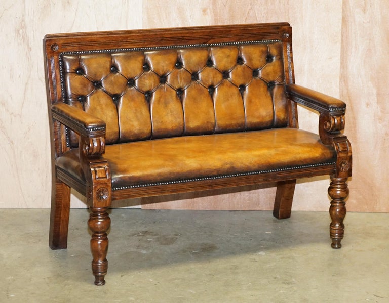 We are delighted to offer this stunning pair of fully restored English Oak and hand dyed brown leather Chesterfield benches

A very good looking and well made pair, they have some good age to them, the timber patina and carving is very nice, they