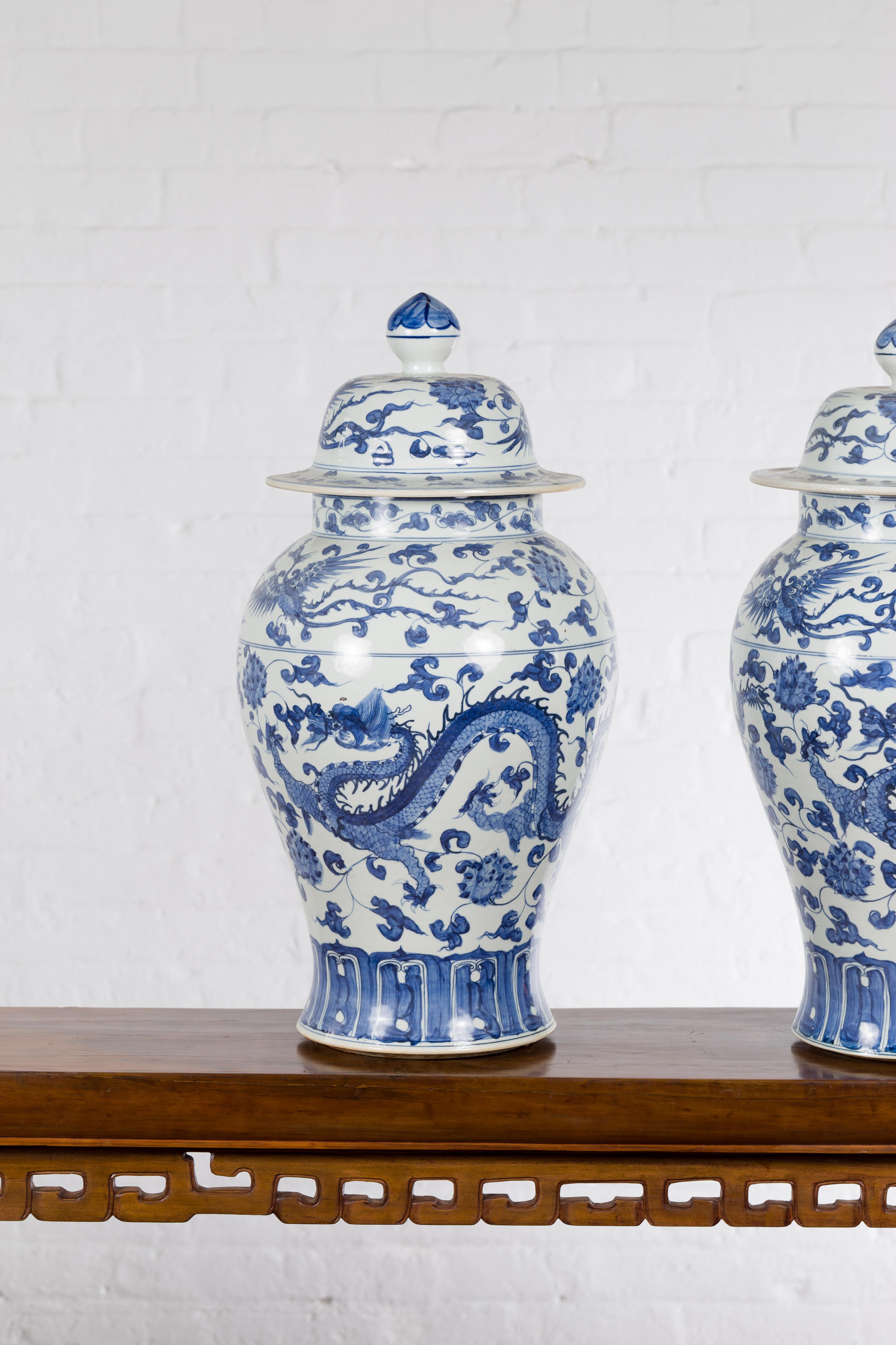 Pair of Vintage Chinese Blue and white Porcelain Lidded Jars with Dragon Motifs In Good Condition In Yonkers, NY