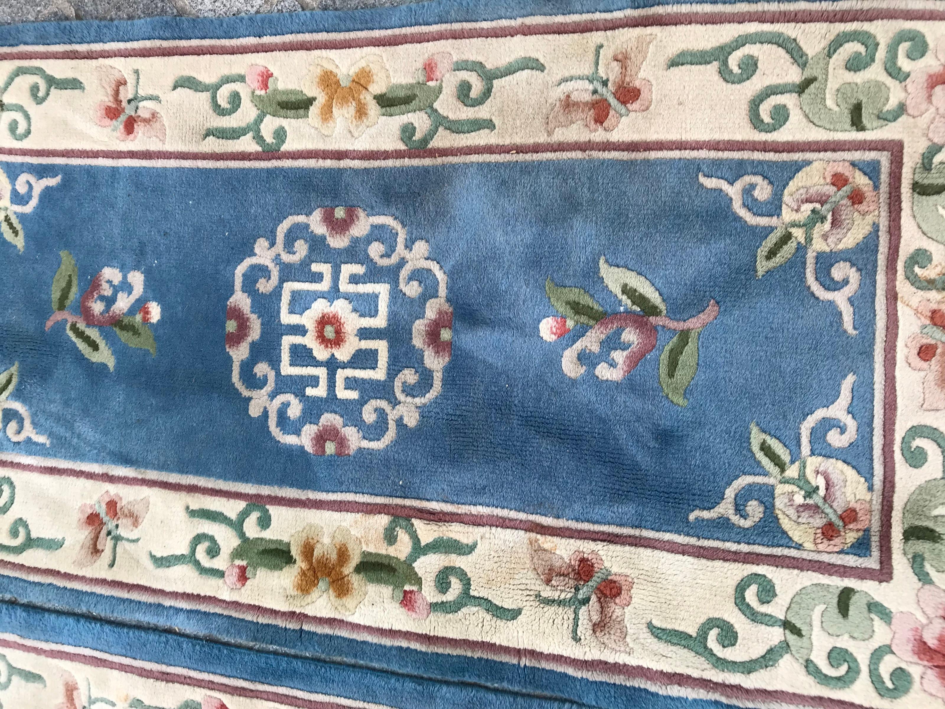 Beautiful pair of rugs with nice Chinese design and a sky blue field color, entirely hand knotted with wool velvet on cotton foundation.