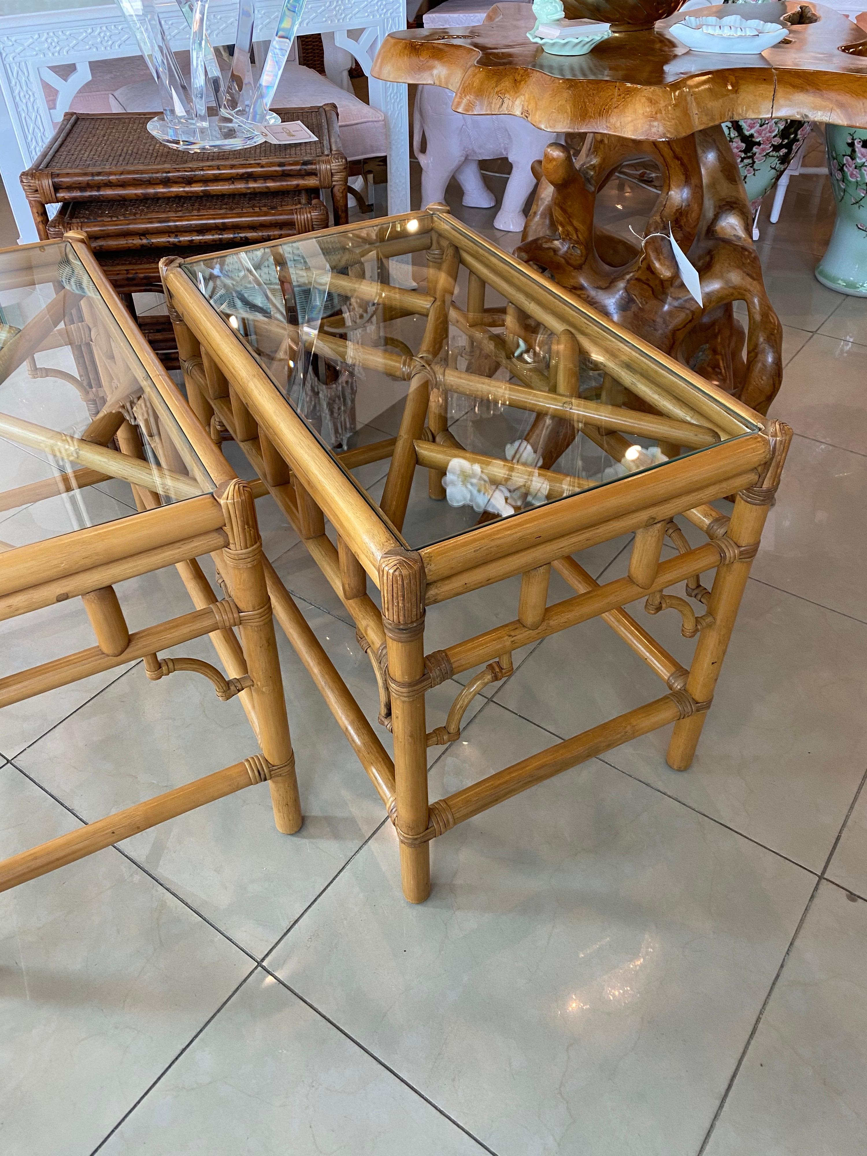 Pair of vintage Chinese Chippendale rattan, glass top end side tables. New glass has been cut for the top. No damage to rattan.