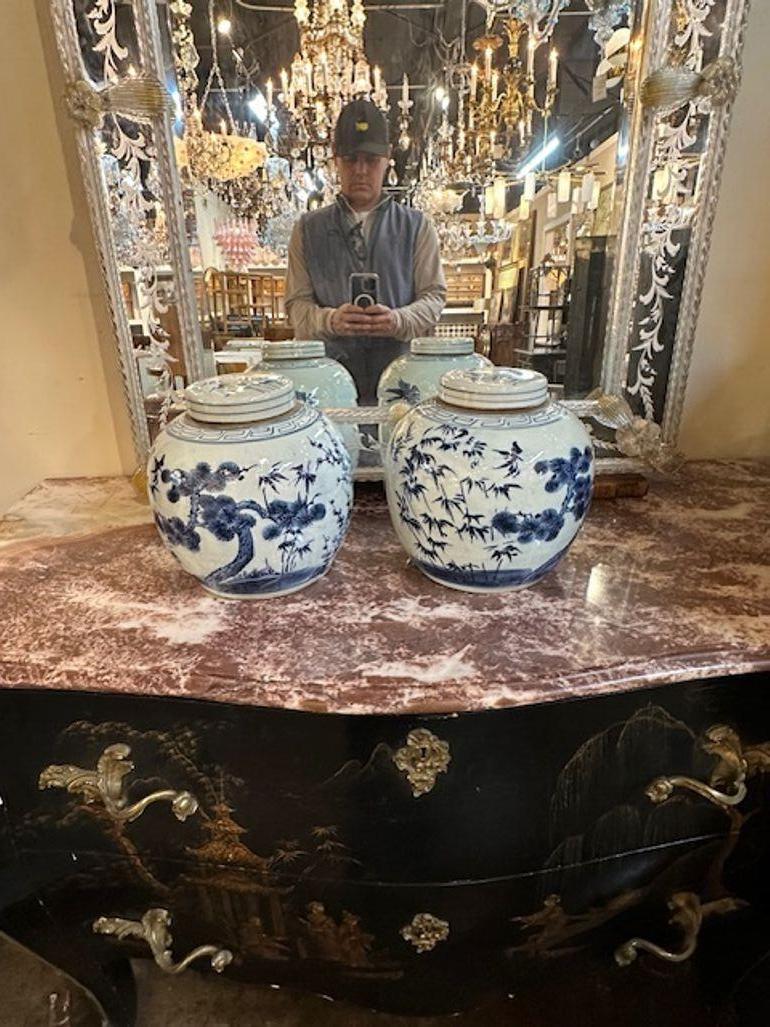 Pair of Vintage Chinese export porcelain blue and white covered jars. Circa 1920. A timeless and classic touch for a fine interior.