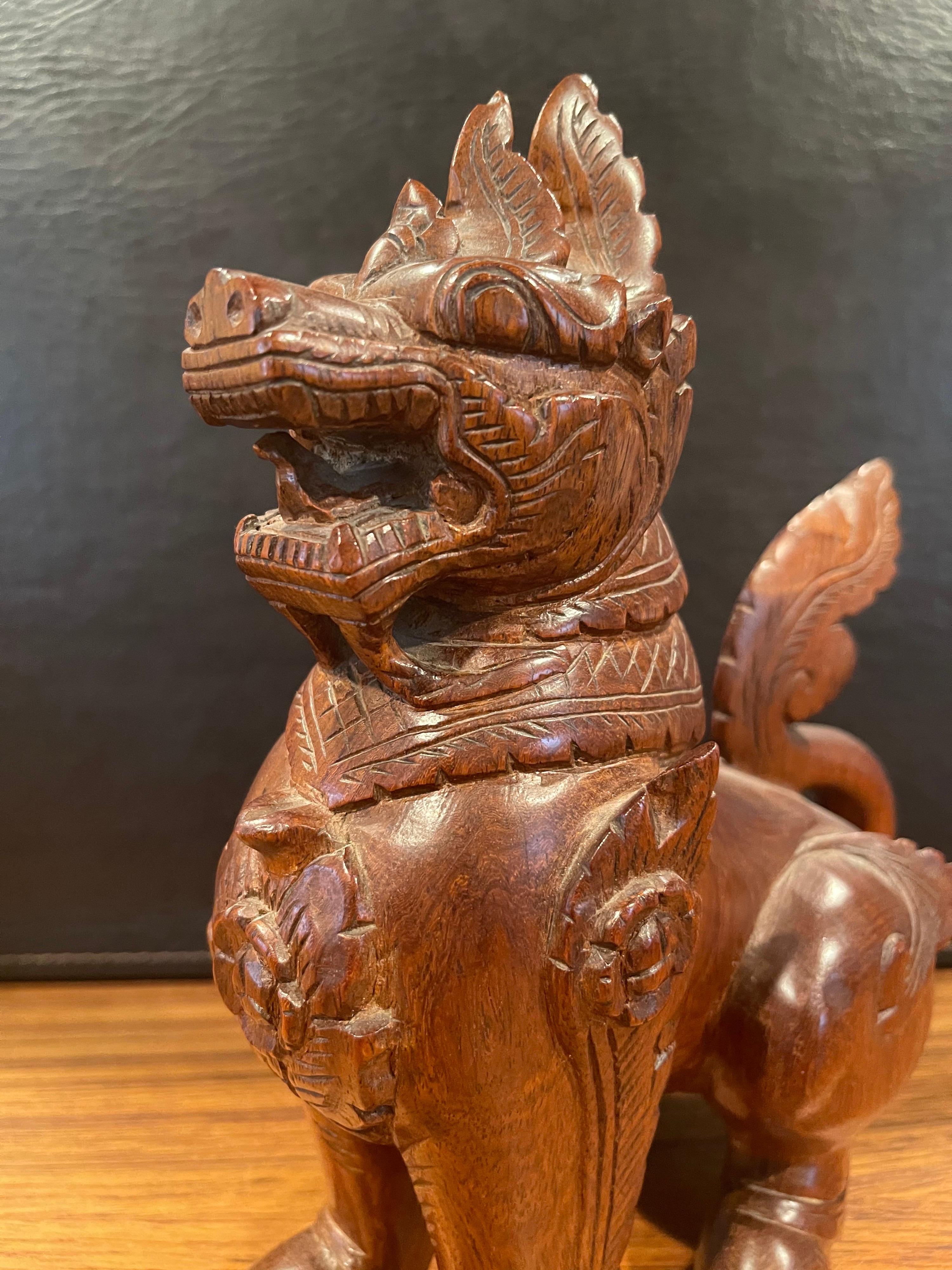 Pair of Vintage Chinese Hand Carved Hard Wood Foo Dogs For Sale 4