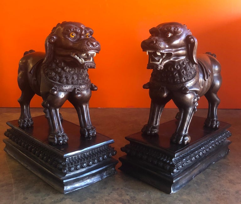 Pair of Vintage Chinese Hand Carved Hard Wood Foo Dogs For Sale at