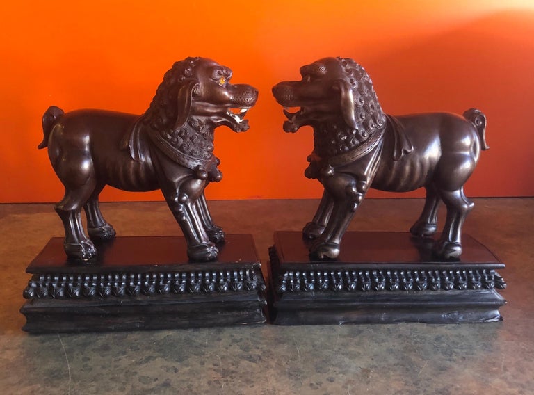Pair of Vintage Chinese Hand Carved Hard Wood Foo Dogs For Sale at