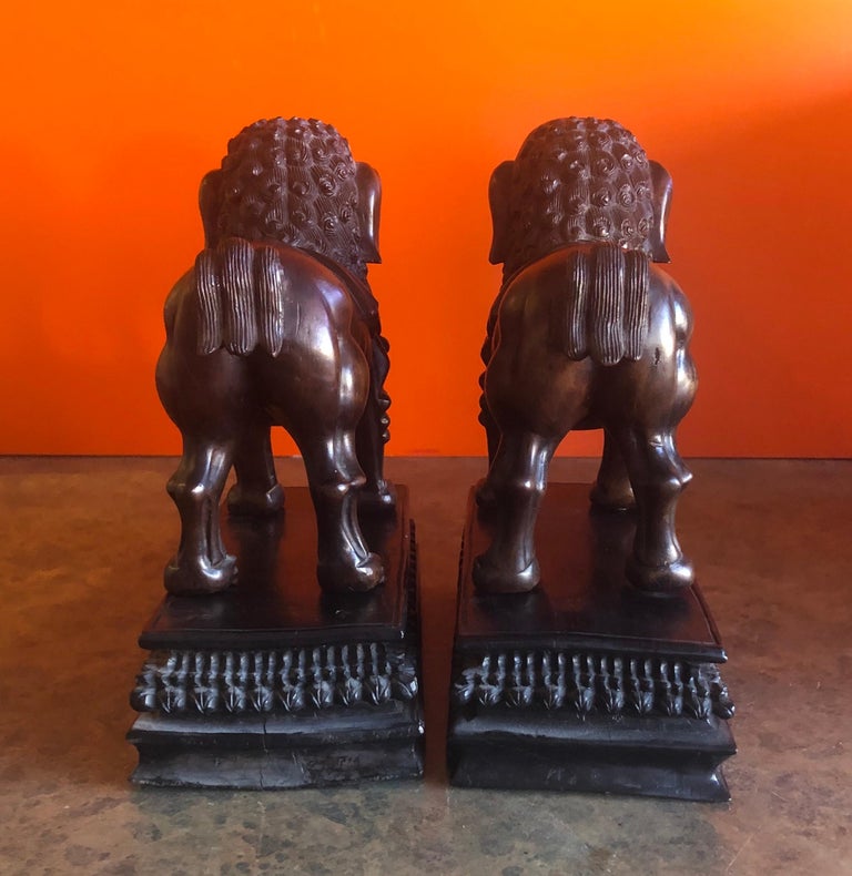 Pair of Vintage Chinese Hand Carved Hard Wood Foo Dogs For Sale at