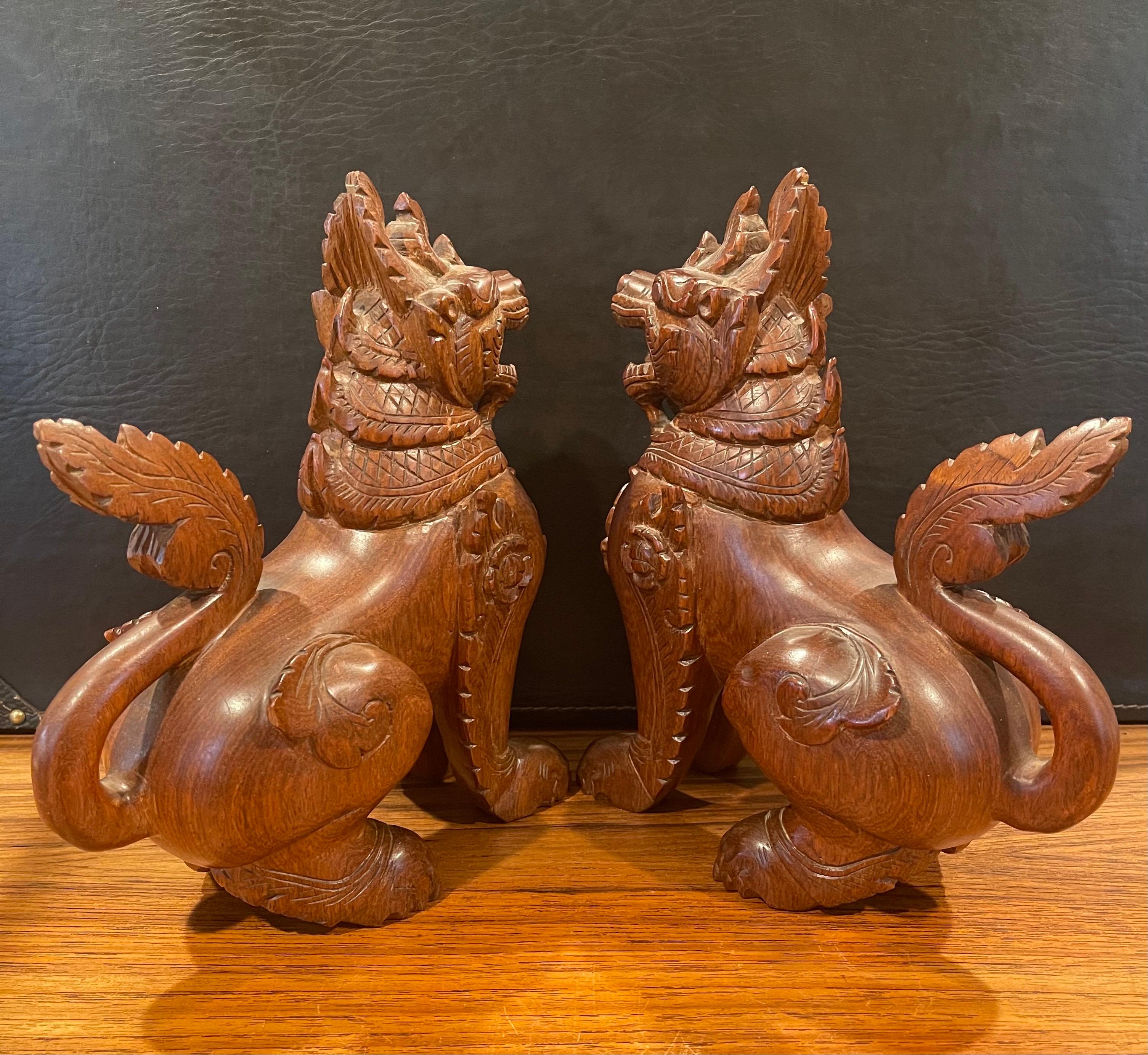 Mid-Century Modern Pair of Vintage Chinese Hand Carved Hard Wood Foo Dogs For Sale