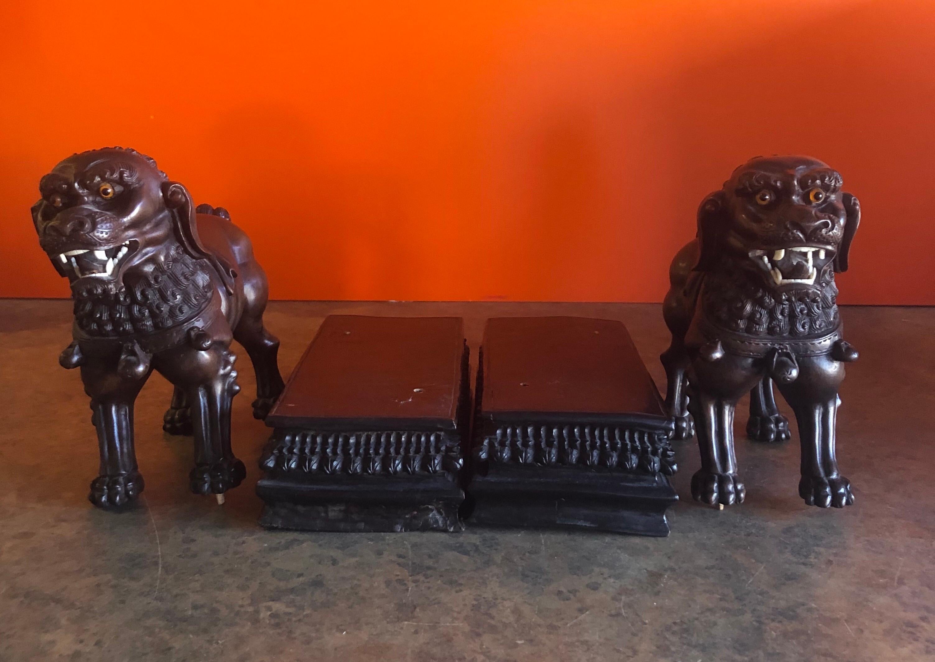 20th Century Pair of Vintage Chinese Hand Carved Hard Wood Foo Dogs For Sale