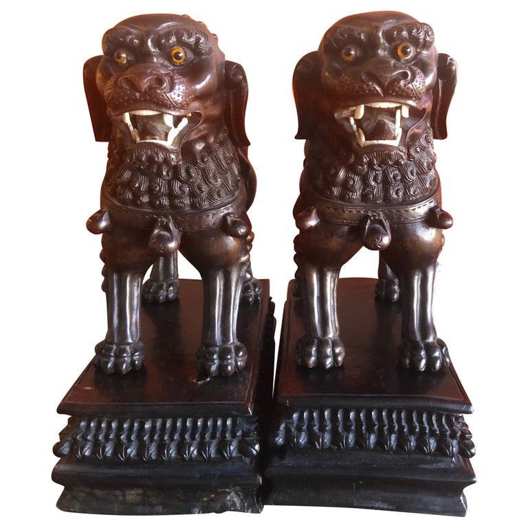 Pair of Vintage Chinese Hand Carved Hard Wood Foo Dogs For Sale at