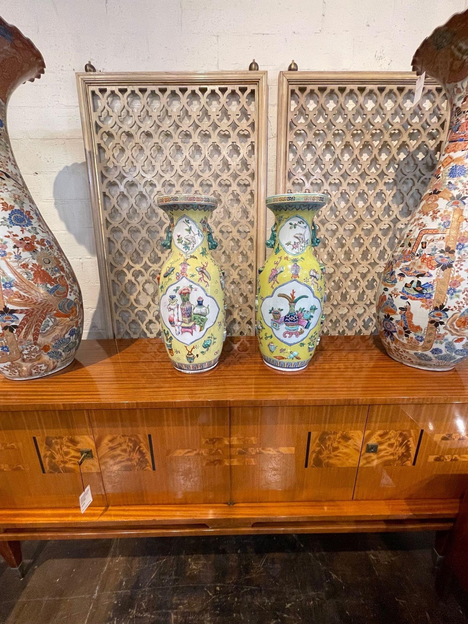 Beautiful pair of vintage Chinese yellow porcelain vases. Circa 1920. A timeless and classic touch for a fine interior.