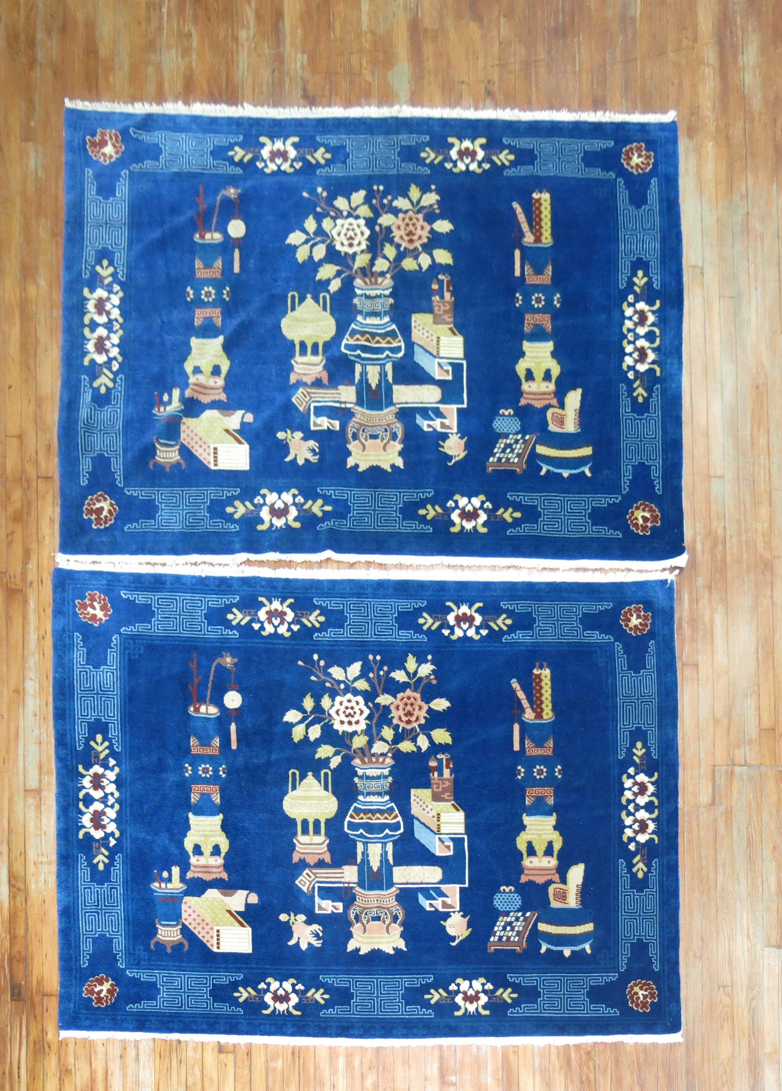 A pair of accent size Chinese rugs from the 3rd quarter of the 20th century.

Measuring 5'4'' x 7'6'' & 5'3'' x 7'8'' respectively.