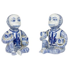 Pair of Vintage Chinese Style Blue and White Monkey Candlestick Holder