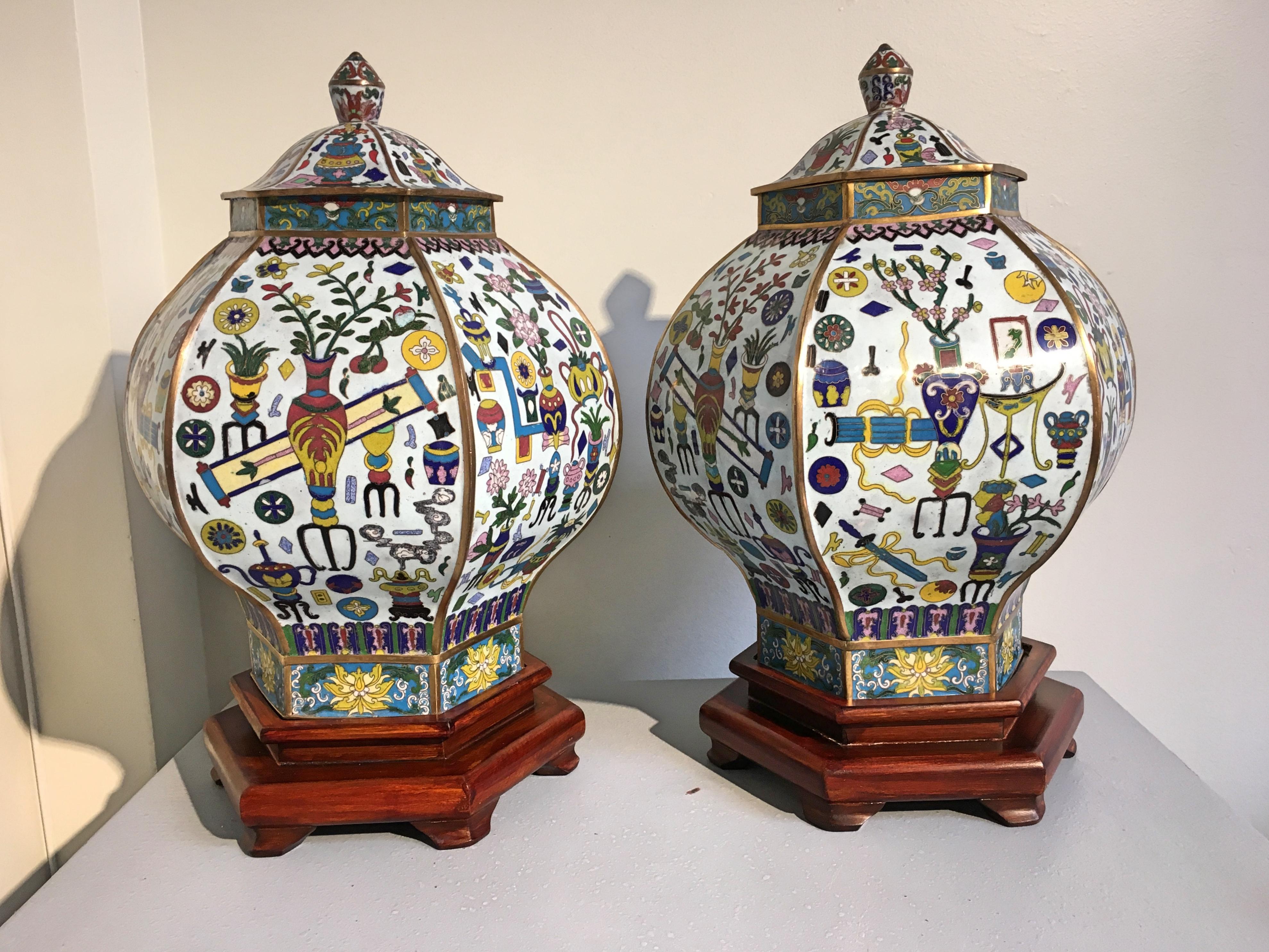 An impressive pair of vintage Chinese hexagonal covered cloisonné vases or jars featuring the 