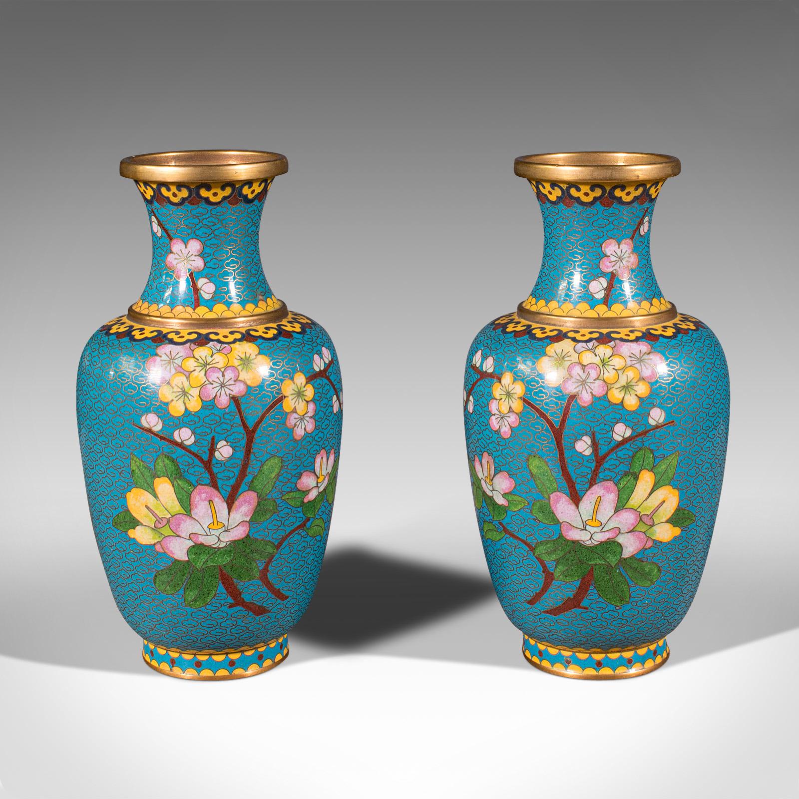 This is a pair of vintage cloisonné posy vases. A Chinese, painted enamel flower baluster, dating to the late Art Deco period, circa 1940.

Graced with wonderful colour and tonality
Displays a desirable aged patina in good order
Enamelled body a