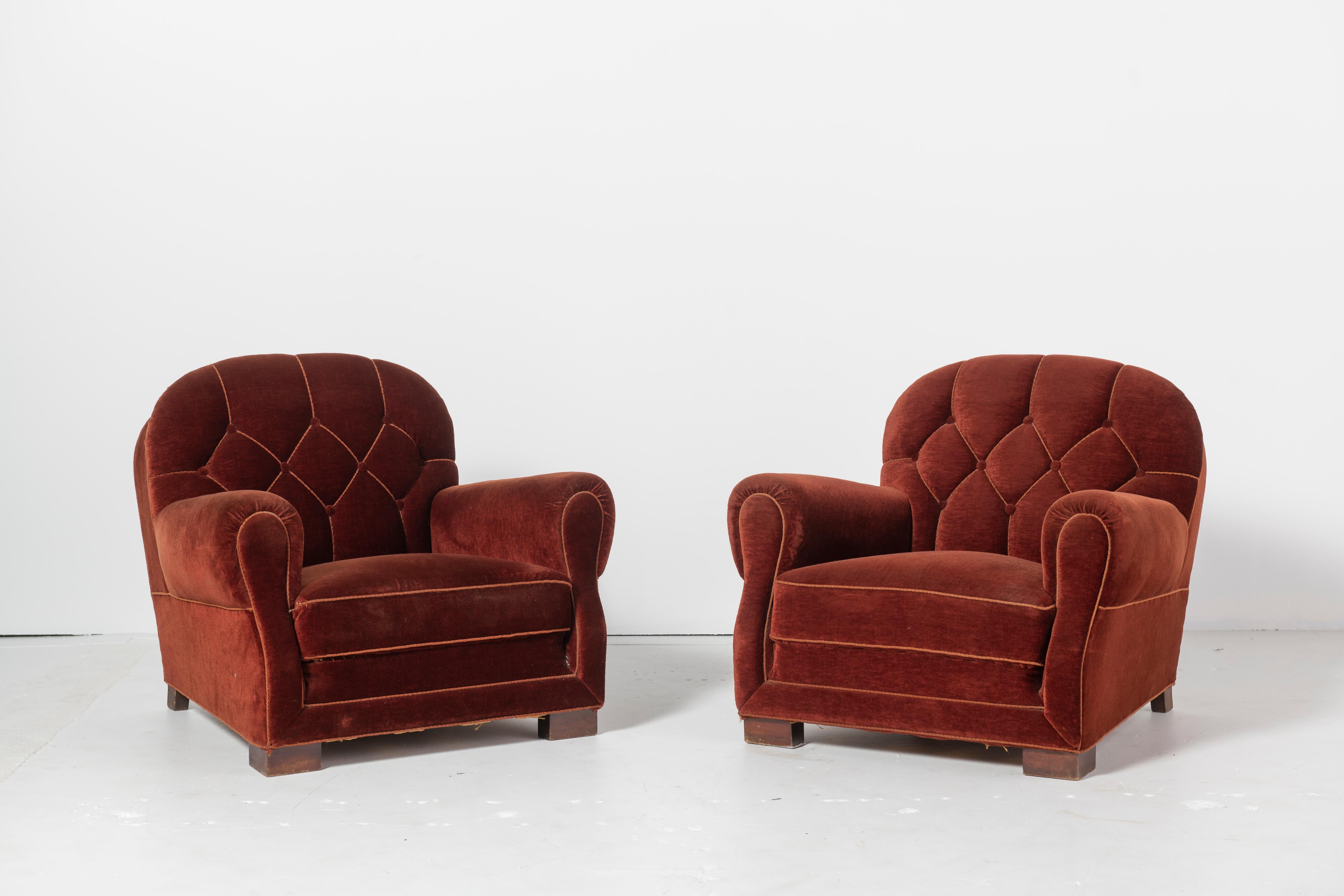 Pair of European, most likely Danish, vintage mohair club chairs in deep rust mohair with wheat-colored trim and piping.