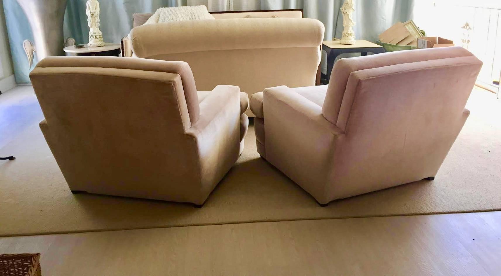 These club chairs are beautifully made and very substantial. The maker is unknown, but they most likely date back to the 1970s. Their boxy shape and clean lines are very reminiscent of the one of the greatest French designers of the Art Deco period,