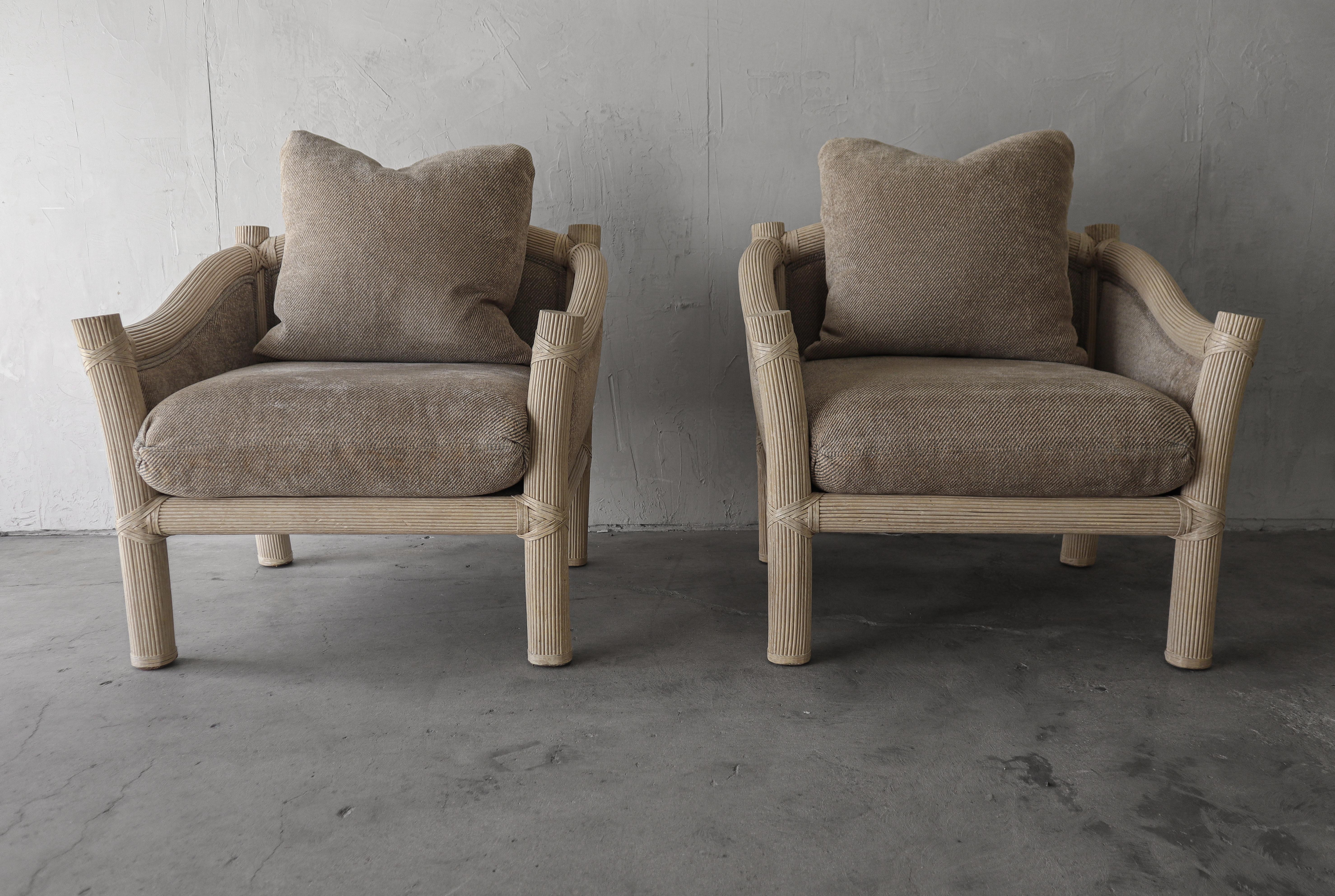 Vintage, white washed, reeded bamboo lounge chairs. Great chairs with super organic feel.  These chair give a very cozy, coastal sunroom vibe.

Chair are sold as found.  Fabric shows several areas of discoloration, reupholstery required.  Down