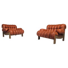 Pair of vintage cognac leather and solid oak lounge chairs, Germany, 1970s