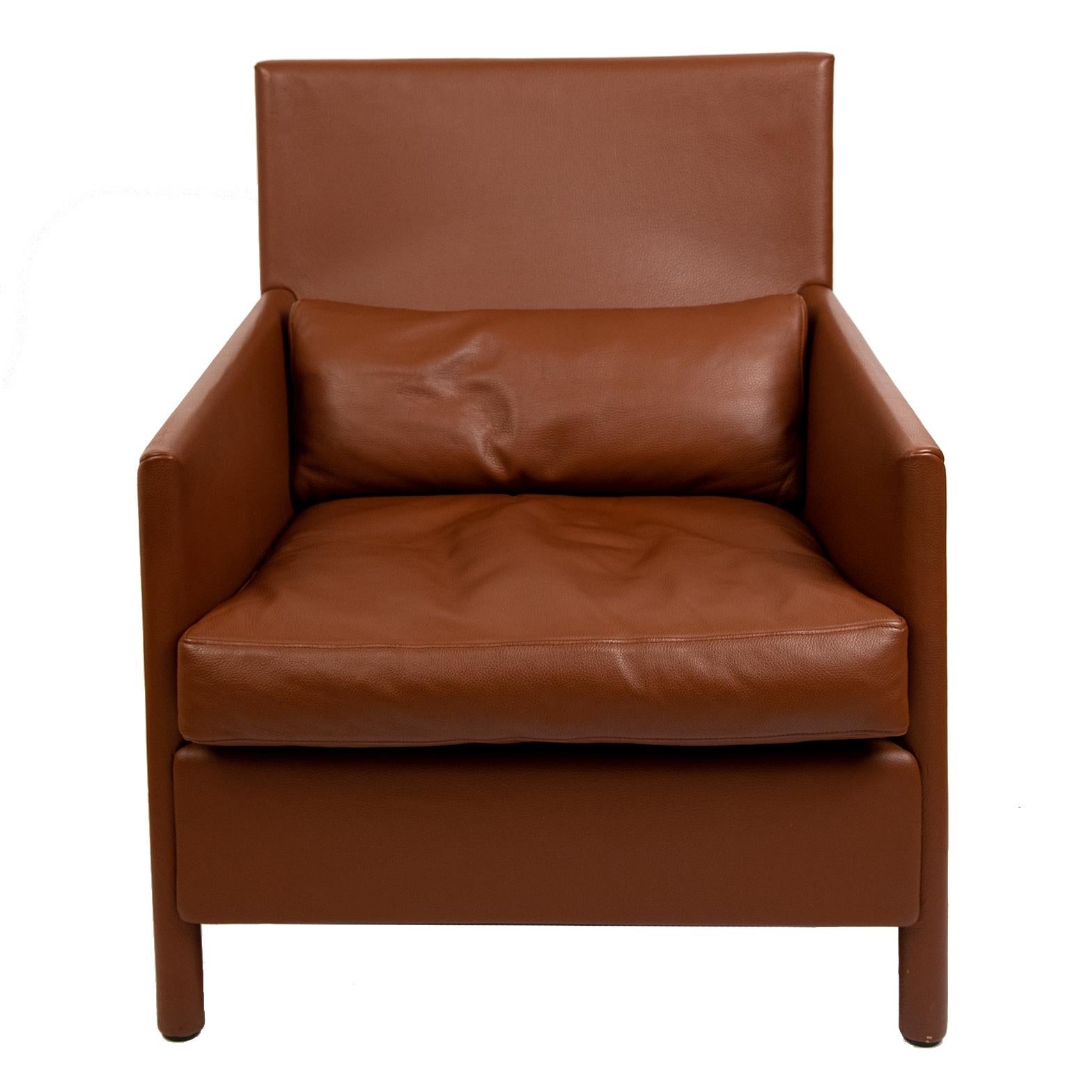 These gorgeous and rich cognac brown full grain leather lounge chairs are in beautiful vintage condition with
no rips or tears. The cushions are down filled. There are 4 available. And are priced per pair.