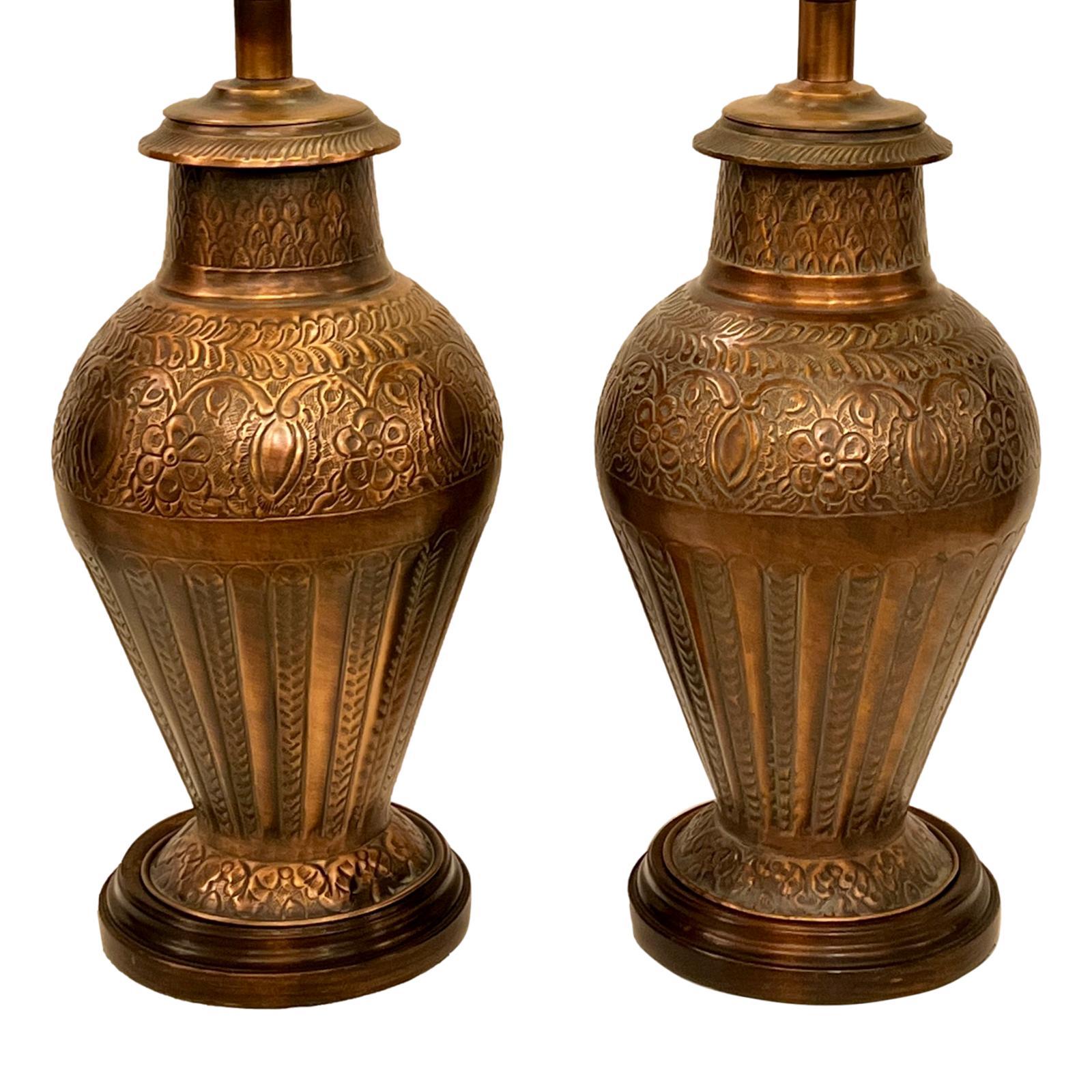 Pair of French circa 1950's hammered copper lamps.

Measurements:
Height: 17