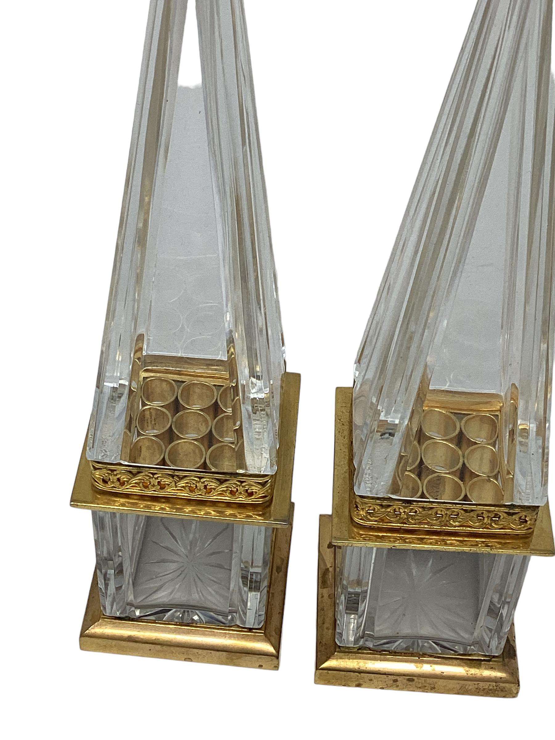 Pair of Vintage Crystal and Gilt Bronze Obelisks. The obelisk separate in the middle as part of the original design. These make a perfect accent on a table or a book shelf.