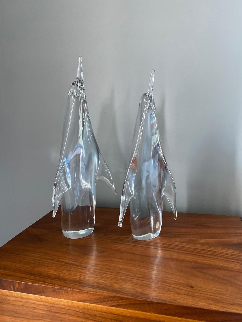Stunning pair of Scandinavian full lead crystal clear glass penguin sculptures. Made by FM Konstglas (which later became Marcolin Art Crystal) of Ronneby, Sweden. These pieces are whimsical and stylish. Evocative sculptures that are warming and