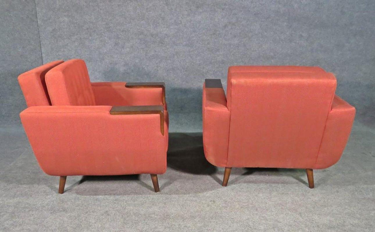 Combining a warm red upholstery with walnut accents, this pair of vintage cube chairs by Charter offers style and comfort. Please confirm item location with seller (NY/NJ).