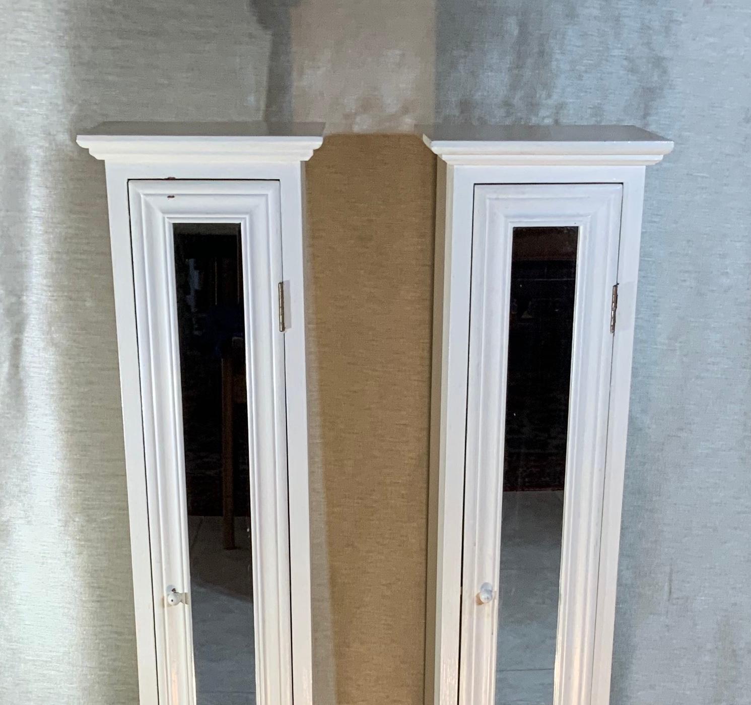Pair of decorative custom cabinets made of solid wood, front door with mirror glass. Each cabinet is divided by four compartments each compartment size is: 8” high x 5”.5 wide x 5”.75 deep. Great for storage use in small Spaces.
Need some tender
