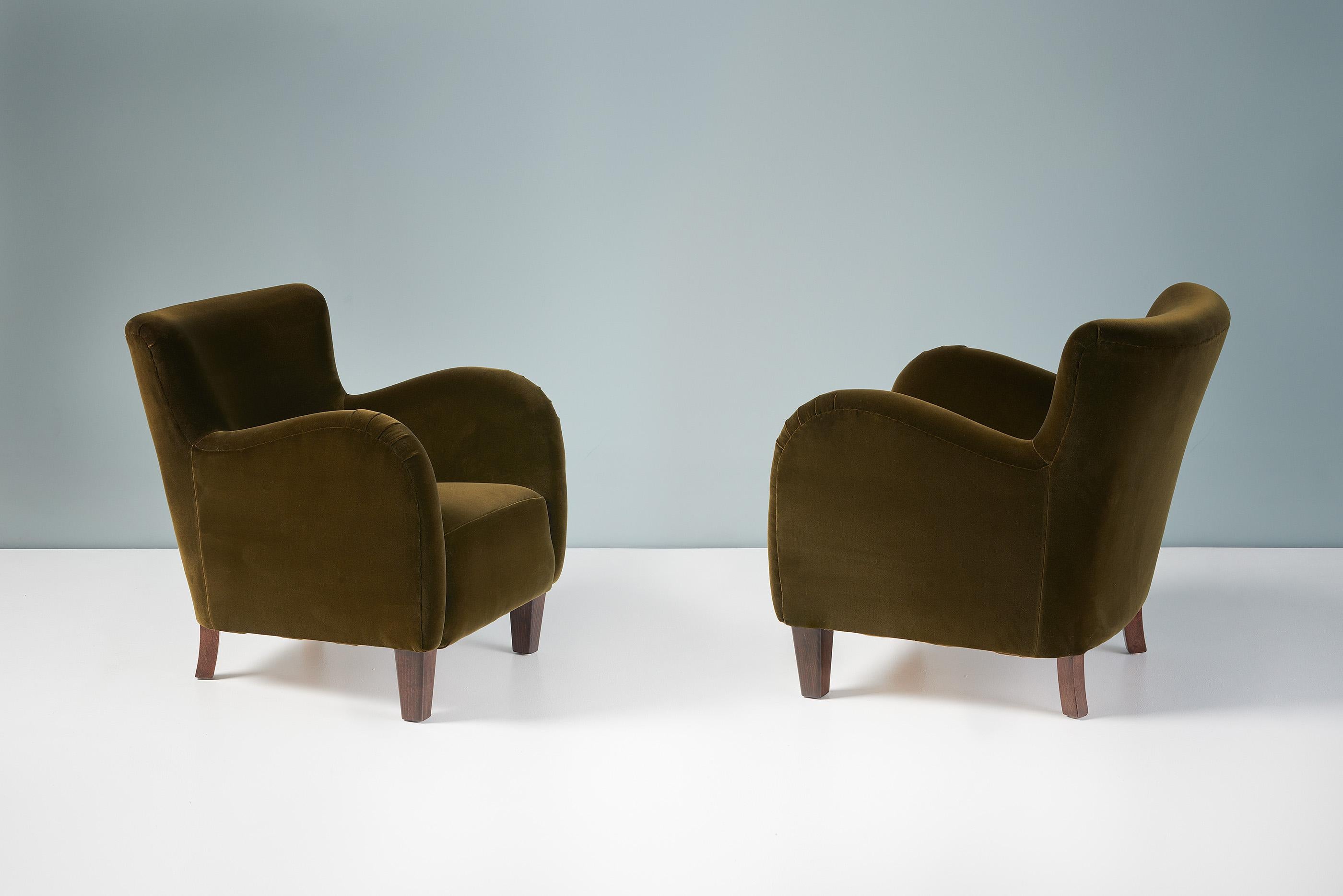 A pair of 1940s lounge chairs produced by a Danish cabinetmaker in the 1940s. These examples have been reupholstered in moss green velvet fabric from Rose Uniacke. The legs are stained beech wood.

Each chair has been fully reconditioned in our