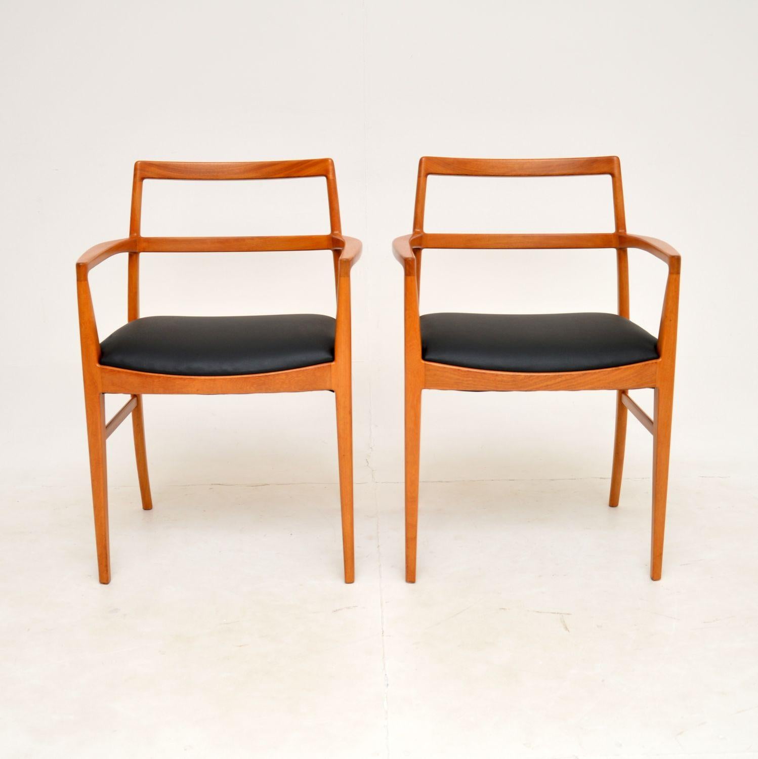 A beautiful and extremely well made pair of vintage Danish carver armchairs. They were designed by Arne Vodder for Sibast, and they date from the 1960’s.

This model is very rare, especially in this wood. It’s hard to be sure, but we believe they