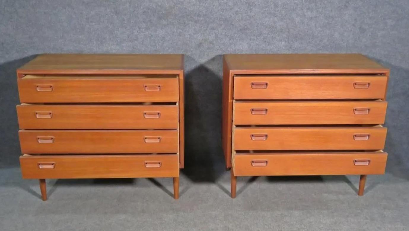 Striking pair of vintage teak dressers, featuring mid-century craftsmanship and quality details like dovetailed drawers and sculpted drawer pulls. Please confirm item location with seller (NY/NJ).