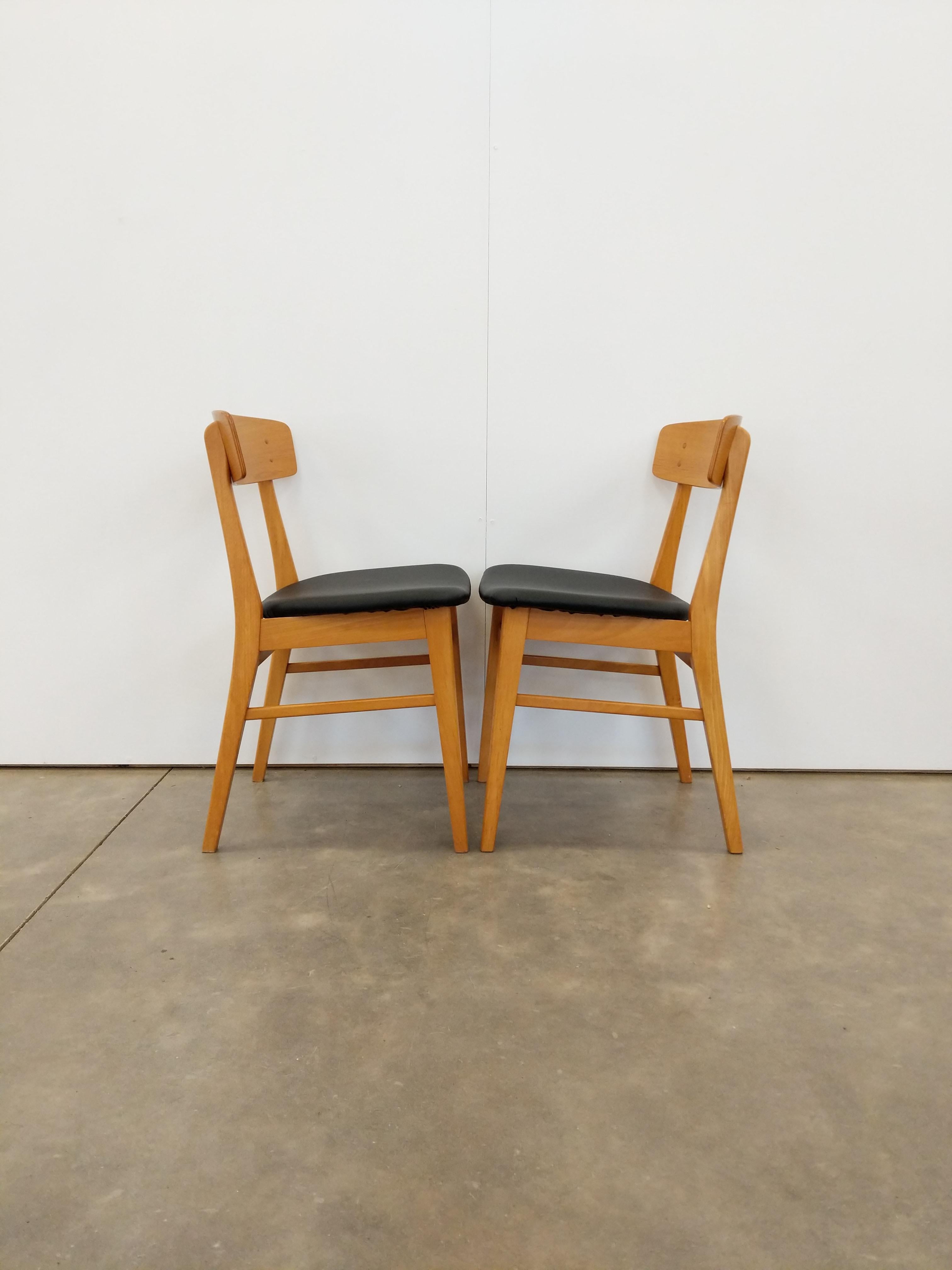 Pair of authentic vintage mid century Danish / Scandinavian Modern dining chairs.

By Farstrup.

Maker's label on bottoms.

This set is in excellent condition with brand new vegan leather upholstery and very few signs of age-related wear (see