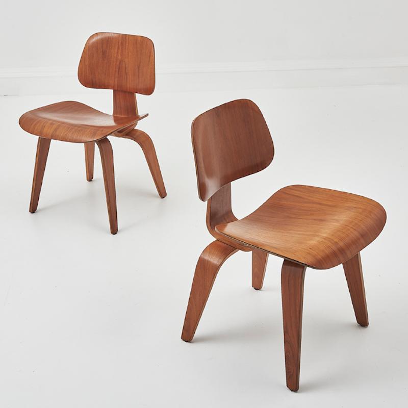 A pair of early mid 20th Century DCW chairs by designers Charles & Ray Eames for Herman Miller. 

These iconic chairs represent the Eames' ground breaking work with moulded plywood and their commitment to blending form and function seamlessly.

The