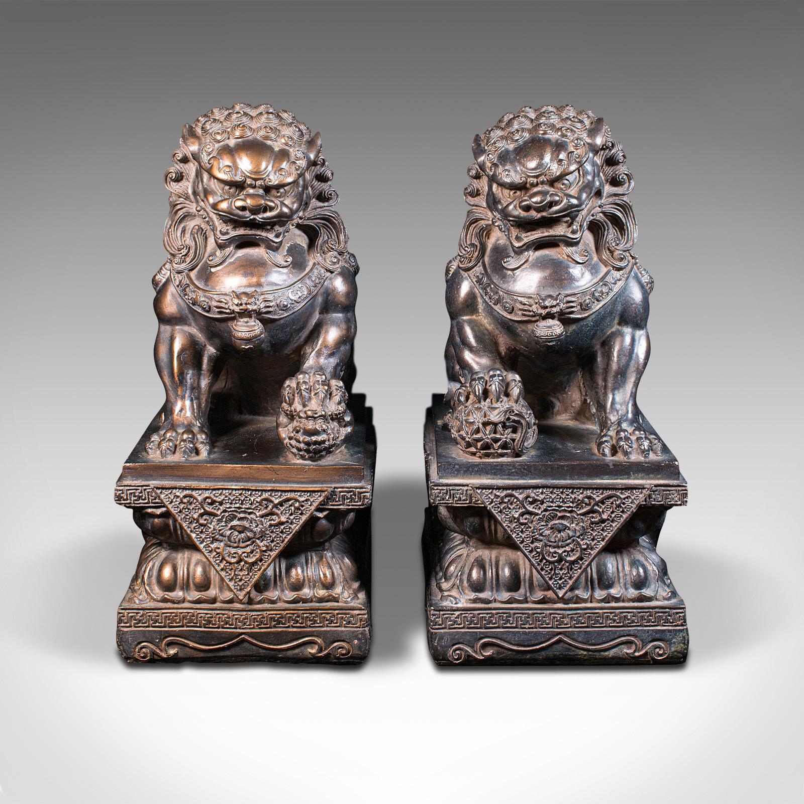 This is a pair of vintage decorative bookends. An Oriental, bronzed resin Dog of Fu figure, dating to the late 20th century, circa 1970.

Wonderful detail with generous proportion
Displaying a desirable aged patina throughout
Quality bronzed