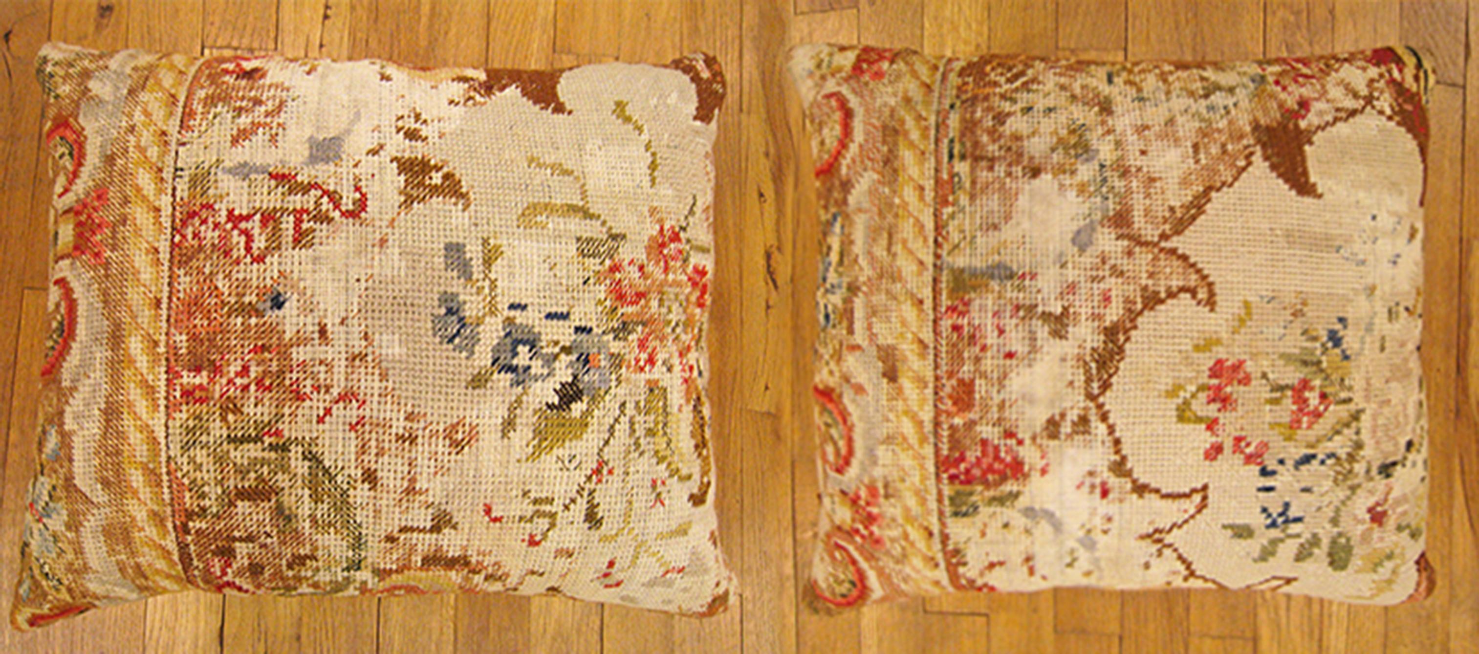 A pair of vintage decorative pillow with a directional floral pattern, sizes 20