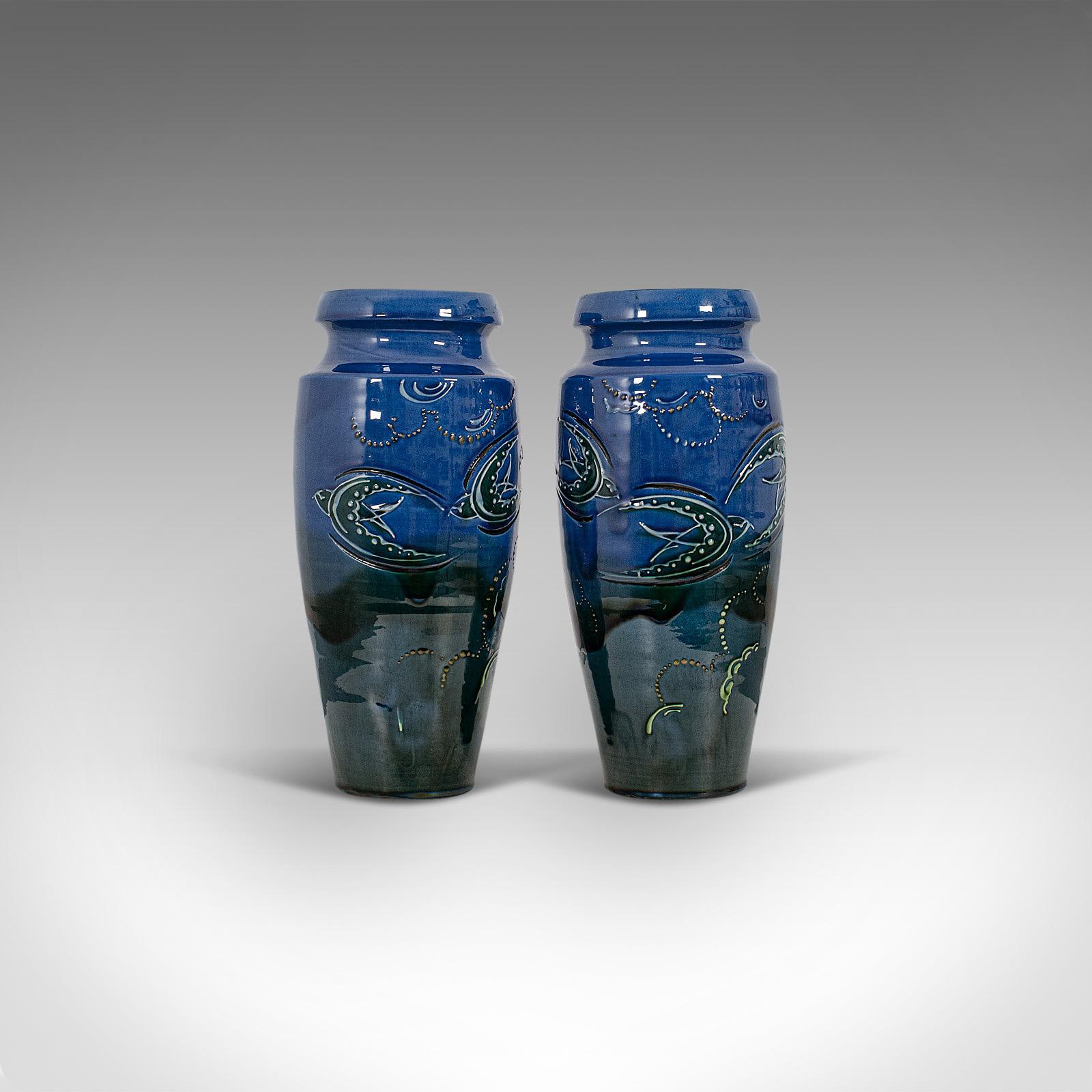 This is a pair of vintage decorative flower vases. An English, ceramic hand painted vase, dating to the early 20th century, circa 1930.

Appealing graduated palette and form
Displaying a desirable aged patina
Ceramic in good order, free of