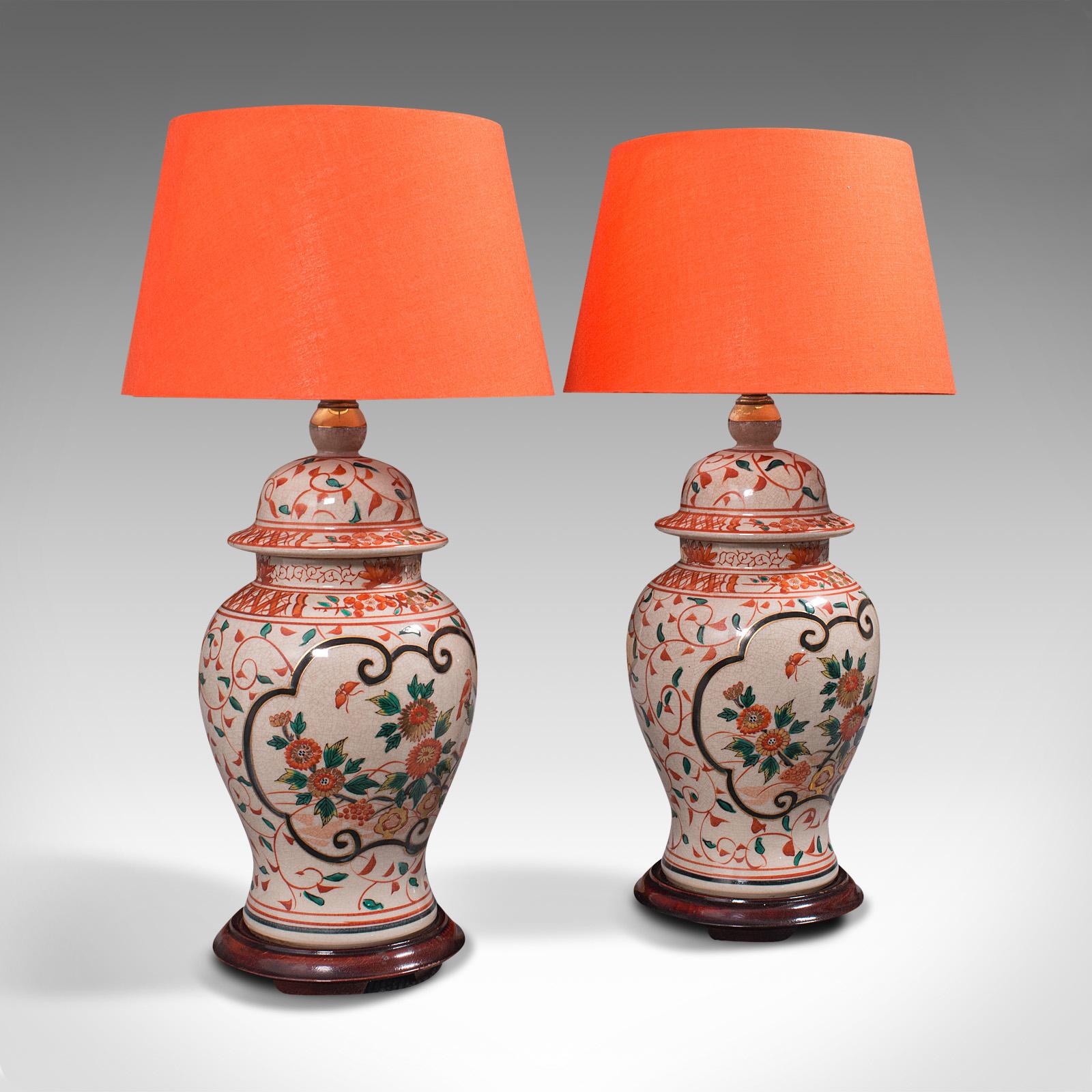 This is a pair of vintage decorative lamps. A Chinese, ceramic baluster urn table light, dating to the late Art Deco period, circa 1940.

Of appealing form and tasteful foliate finish
Displays a desirable aged patina and in good order
Classic