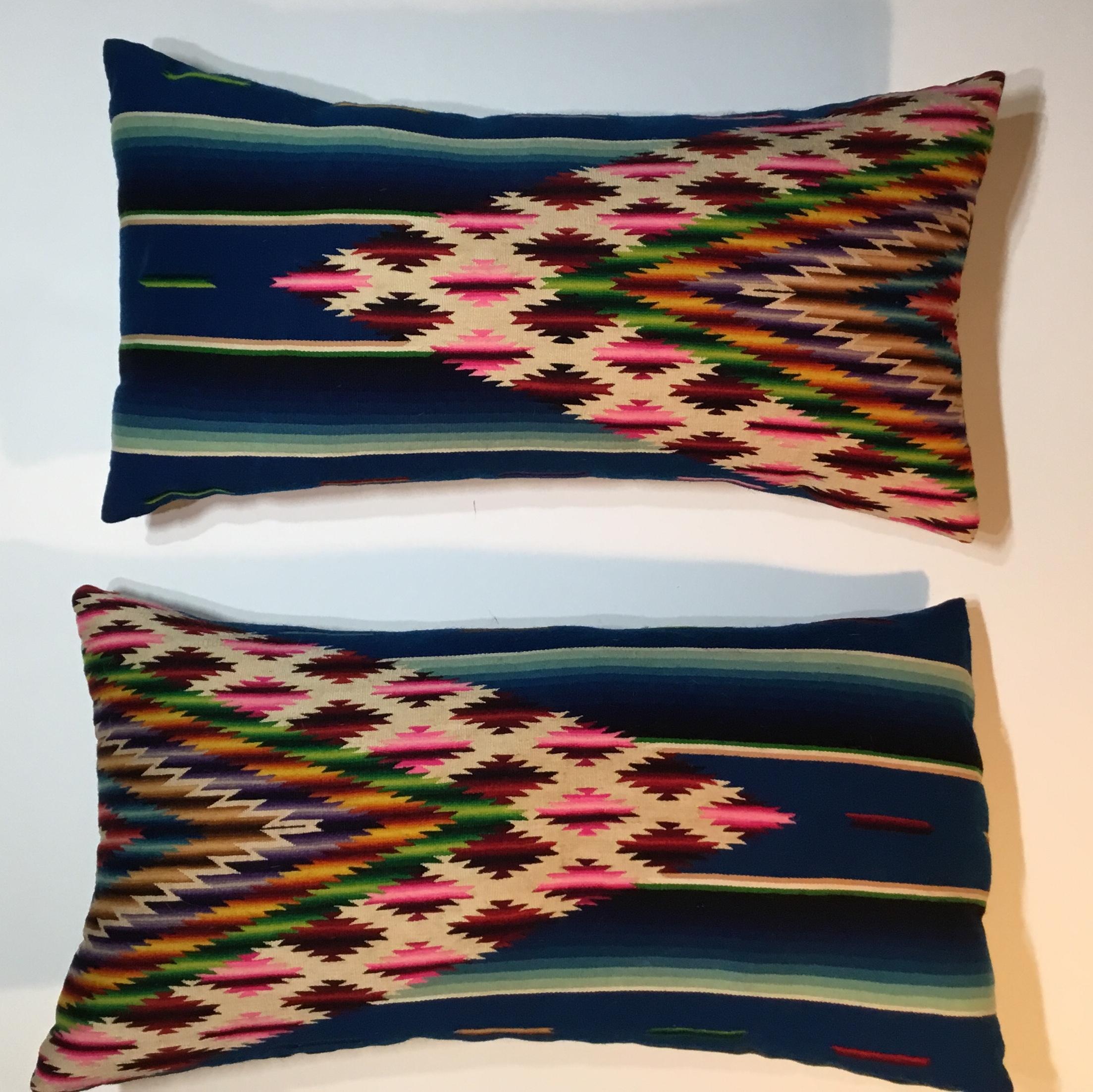 Beautiful pair of pillows made of finely handwoven multi-color vintage Saltillo Mexican blanket.
Originally this price used as wall tapestry and we decided to make pillows from it .the pillows are made with the woven textile back and front ,with