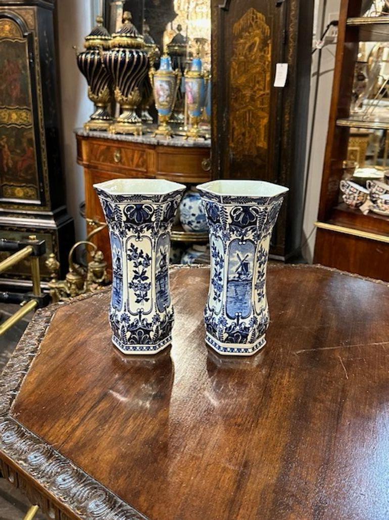 Pair of vintage Delft blue and white vases. Circa 1940. A timeless and classic touch for a fine interior.