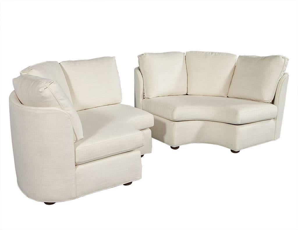 Pair of vintage demilune sofas. These barrel back circular chaise sofas feature three perfectly proportioned pillows, are newly upholstered with new foam and a neutral cotton fabric. A perfect sitting area for a stylish bedroom, living or family