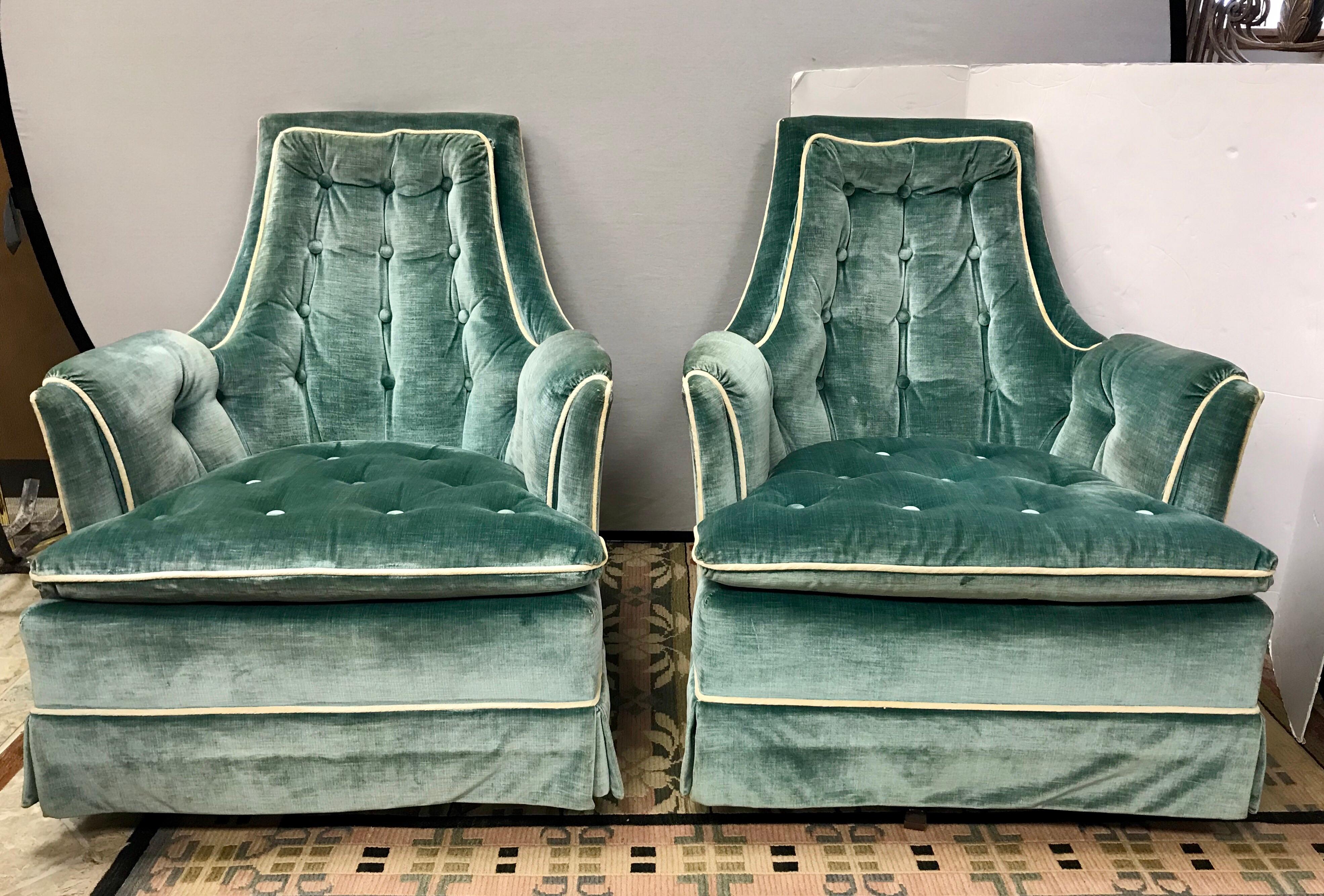 Midcentury 1960s velvet lounge chairs with button tufted back and seats in a beautiful robin’s egg blue color. Chairs rock and swivel 360 degrees and are super comfortable.